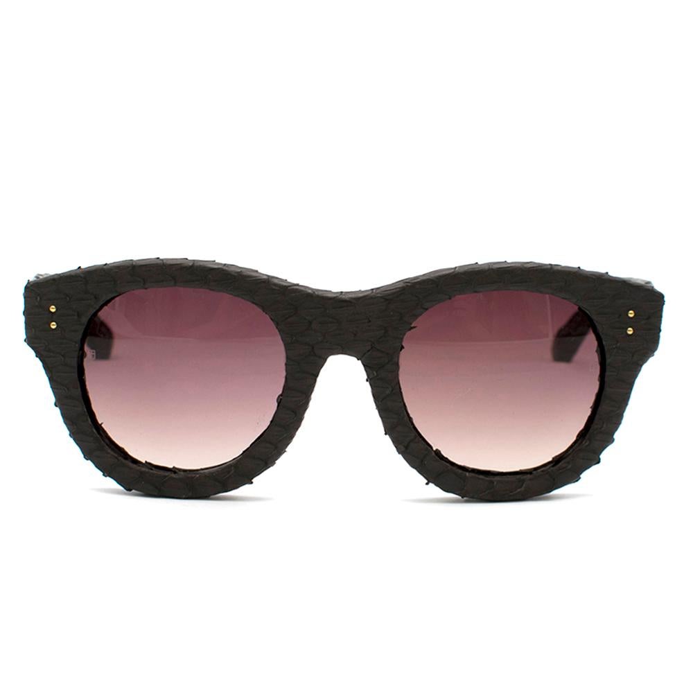 Linda Farrow Brown Python Sunglasses

- brown python sunglasses
- soft square shape
- brown gradient glass

This item comes with the original dust bag and box.

Please note, these items are pre-owned and may show some signs of storage, even when