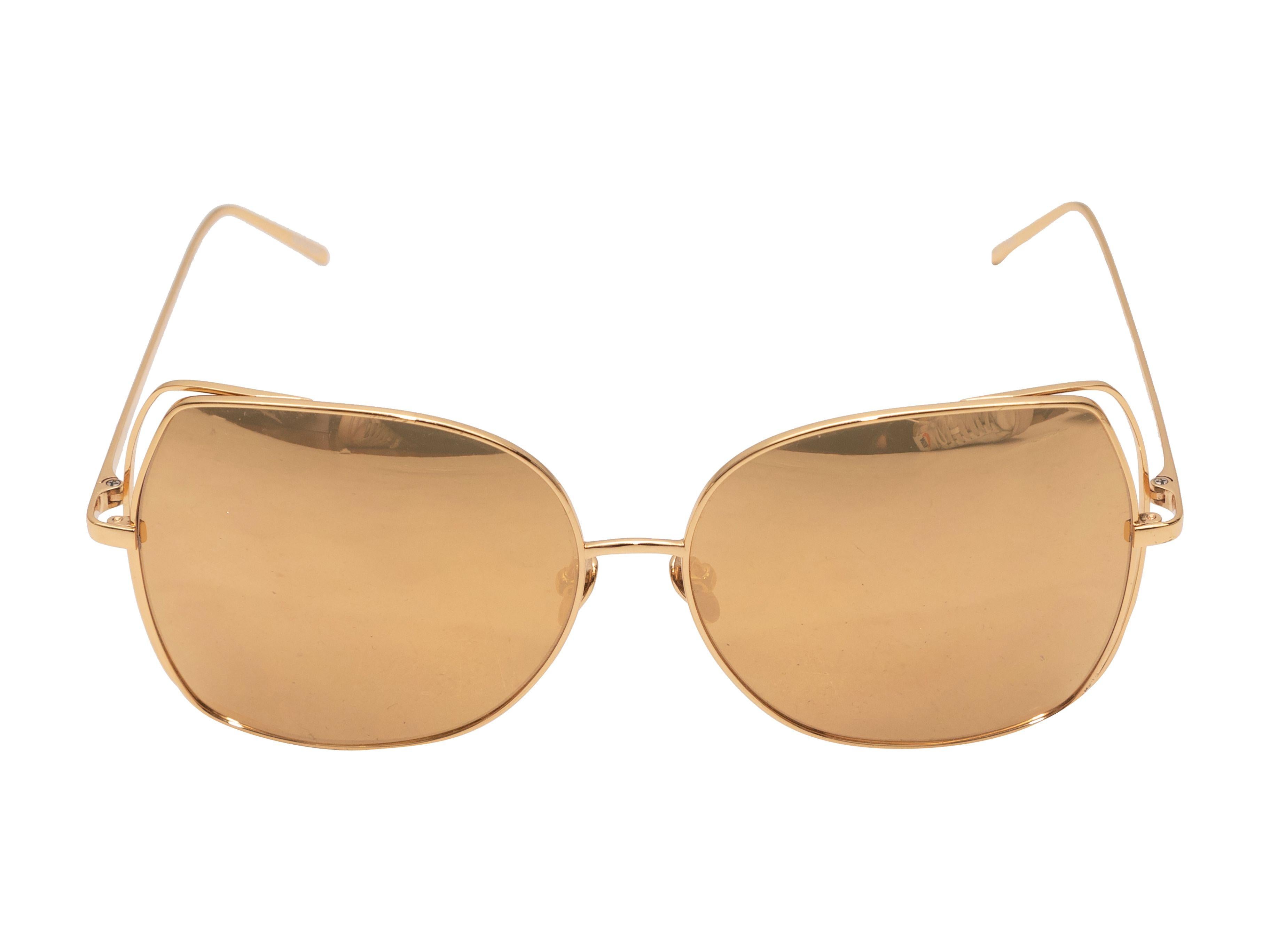 Product Details: Gold-tone metal oversized sunglasses by Linda Farrow. Gold mirrored lenses. 2.25