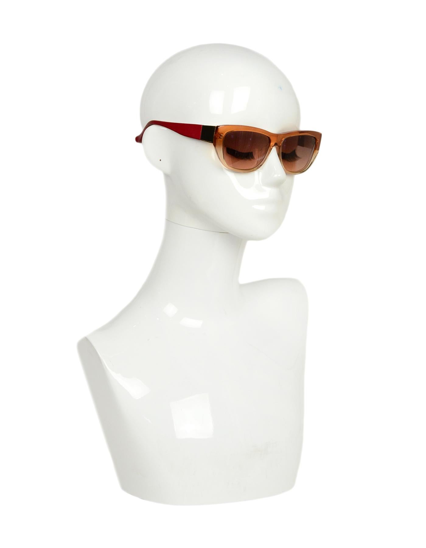 Linda Farrow x The Row Orange Ombre Sunglasses w/ Leather Accent

Made In: Japan
Color: Orange
Hardware: Goldtone hardware
Materials: Resin, leather accent
Overall Condition: Excellent pre-owned condition, with the exception of hairline scratches to