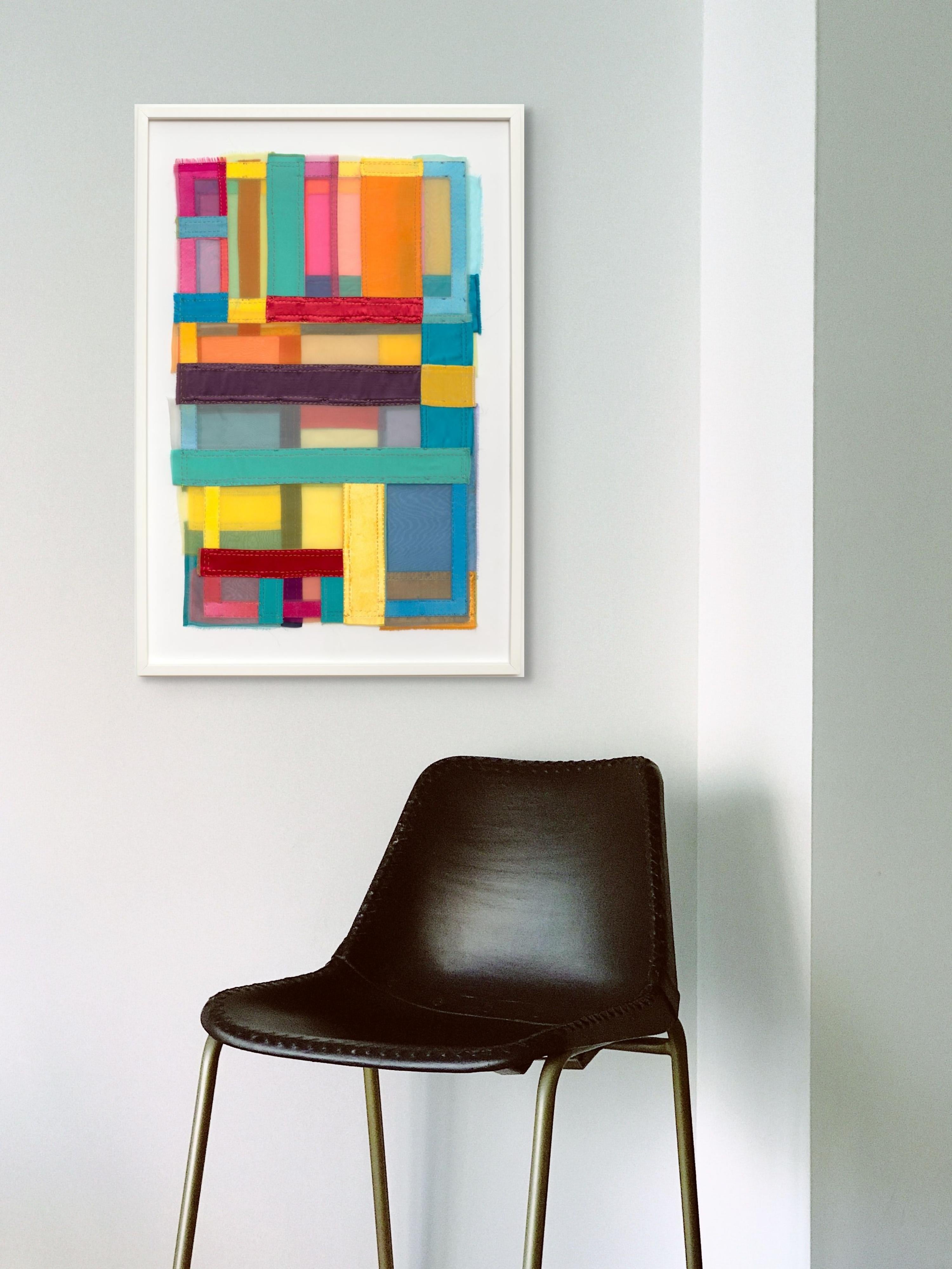 This vibrant fiber artwork features sheer, layered fabrics in a glowing spectrum of jewel tones, citrus brights, and soft pastels. The geometric composition is both hand- and machine-stitched, creating a tactile rhythm of seams, textures, and