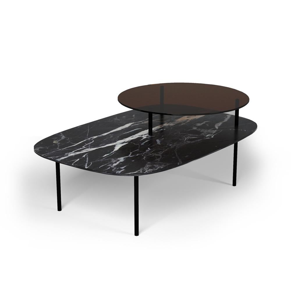 Linda side table by Collector
Designer: Davide Monopoli
Materials: Table top in smoked glass and nero marquina marble. Legs in black lacquered metal.
Dimensions: W 118 x D 80 x H 49 cm

The juxtaposition of two geometric shapes gives Linda Side