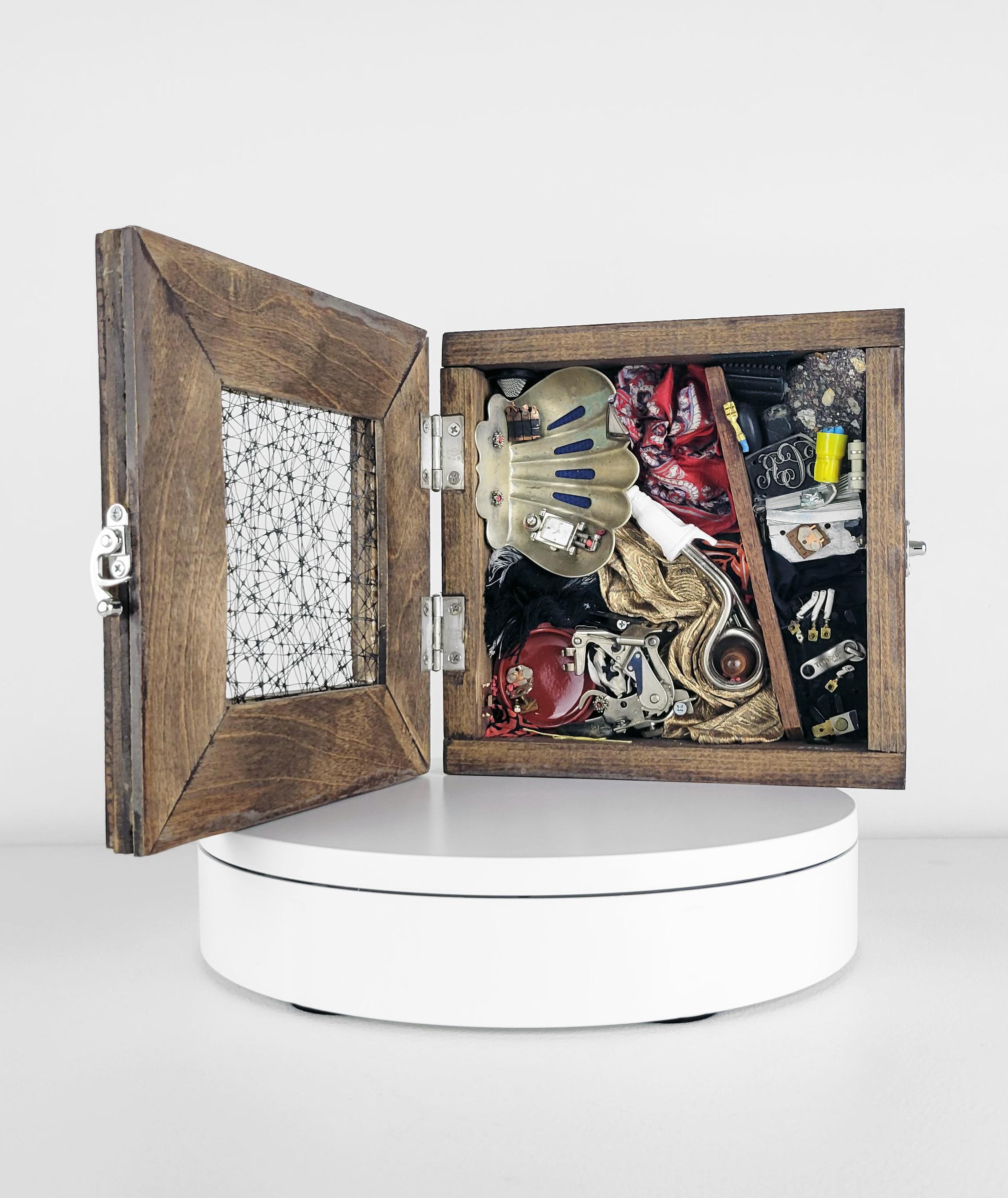Linda Stein, Case 1204 - Contemporary Art Mixed Media Wunderkammer Sculpture

This work from Linda Stein's Displacement From Home series draws from the tradition of wunderkammer/cabinets of curiosities to highlight the global displacement and