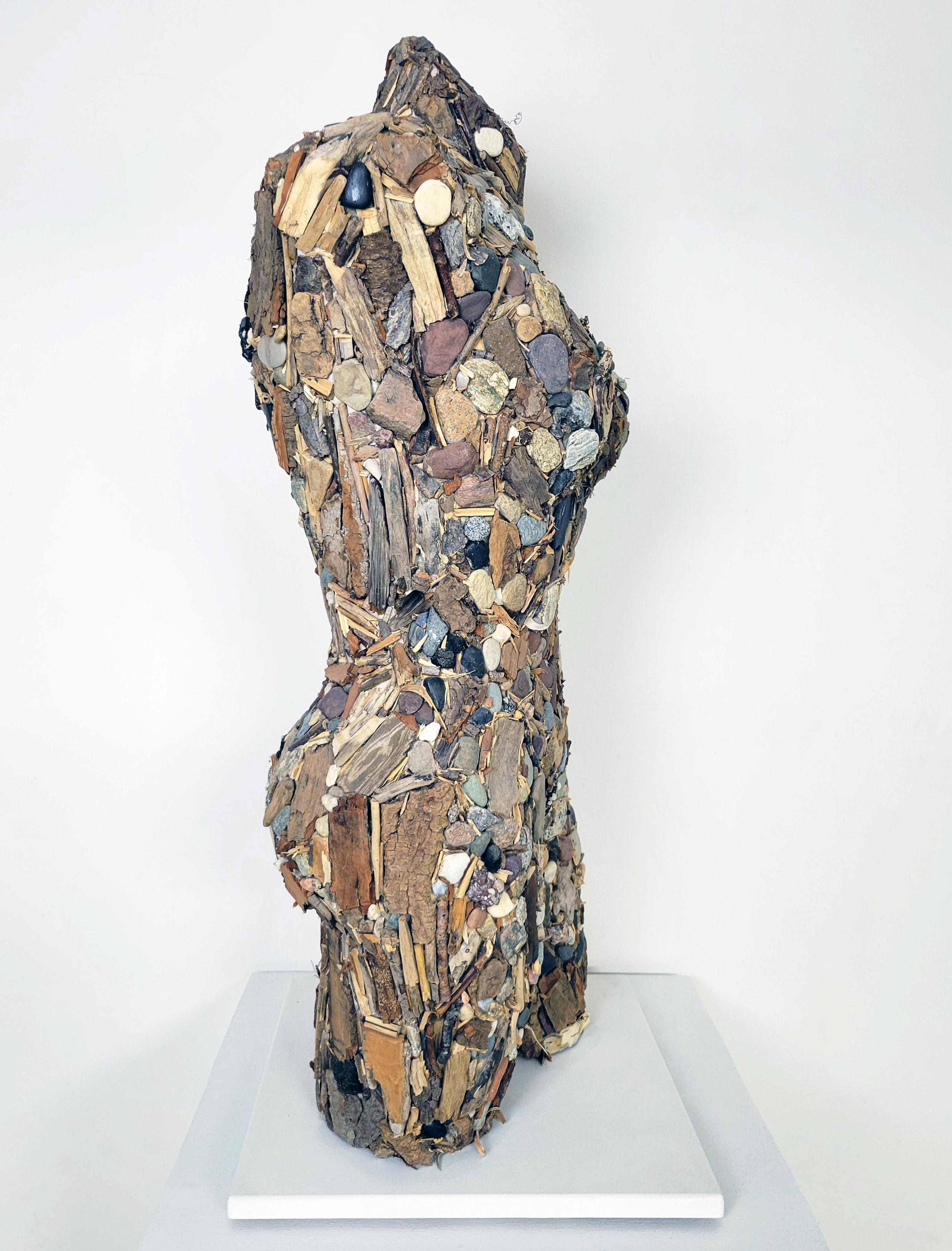 This sculpture from Linda Stein’s I am the Environment series explores the artist's relationship to the earth and addresses the interconnectedness of all living things.  This sculpture is made from found stone, wood and sticks in pleasing earth