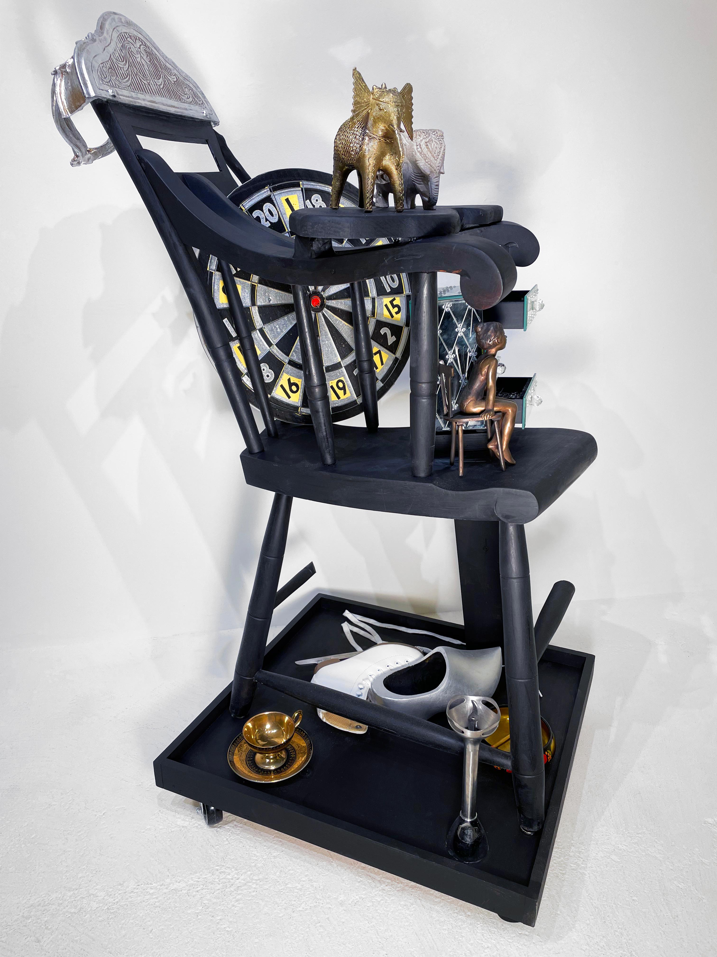 This work from Linda Stein's Displacement From Home series draws from the tradition of wunderkammer/cabinets of curiosities to highlight the global displacement and traumatic memory of migrants and refugees around the world. 

Works from this series