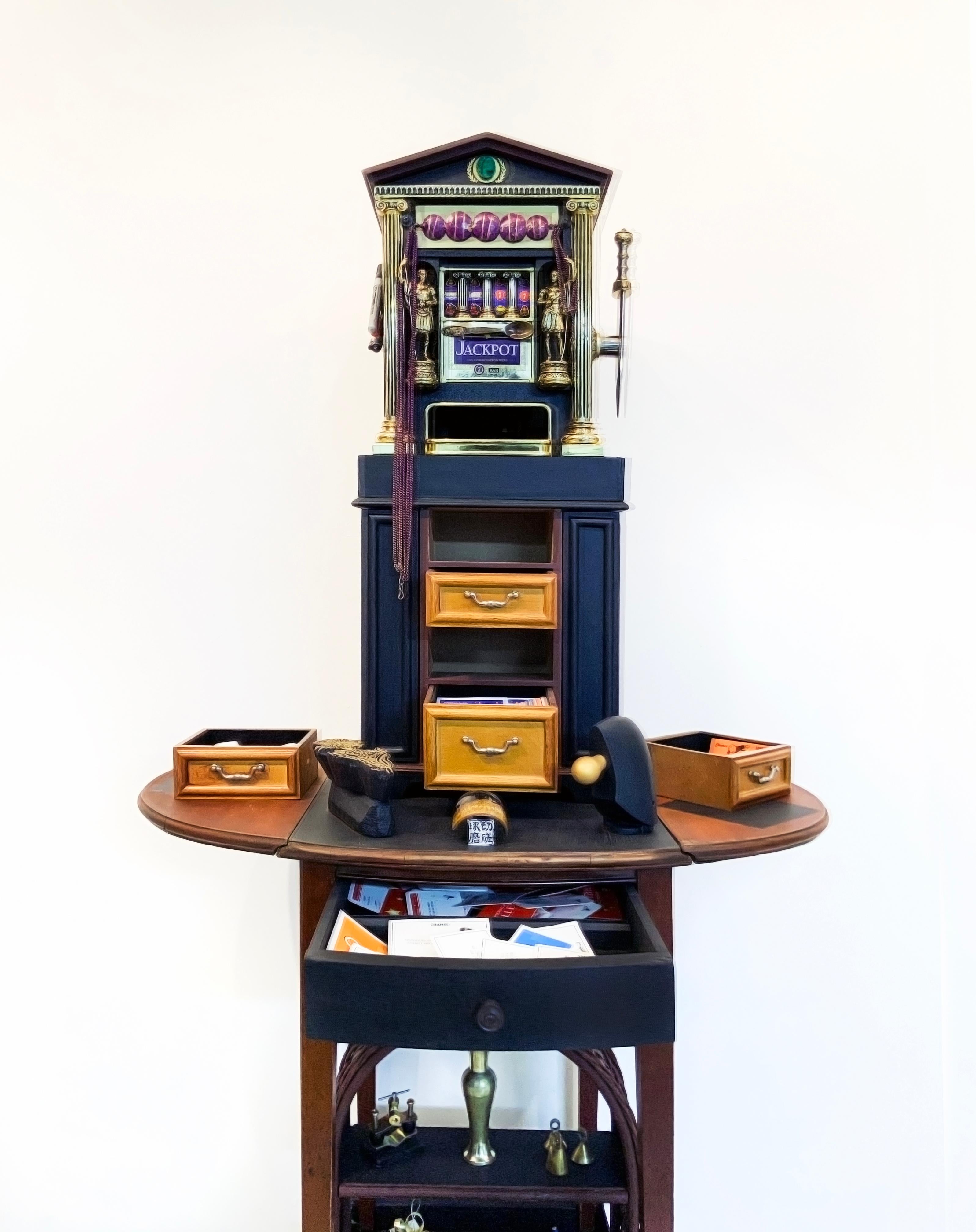 This work from Linda Stein's Displacement From Home series draws from the tradition of wunderkammer/cabinets of curiosities to highlight the global displacement and traumatic memory of migrants and refugees around the world. 

Works from this series