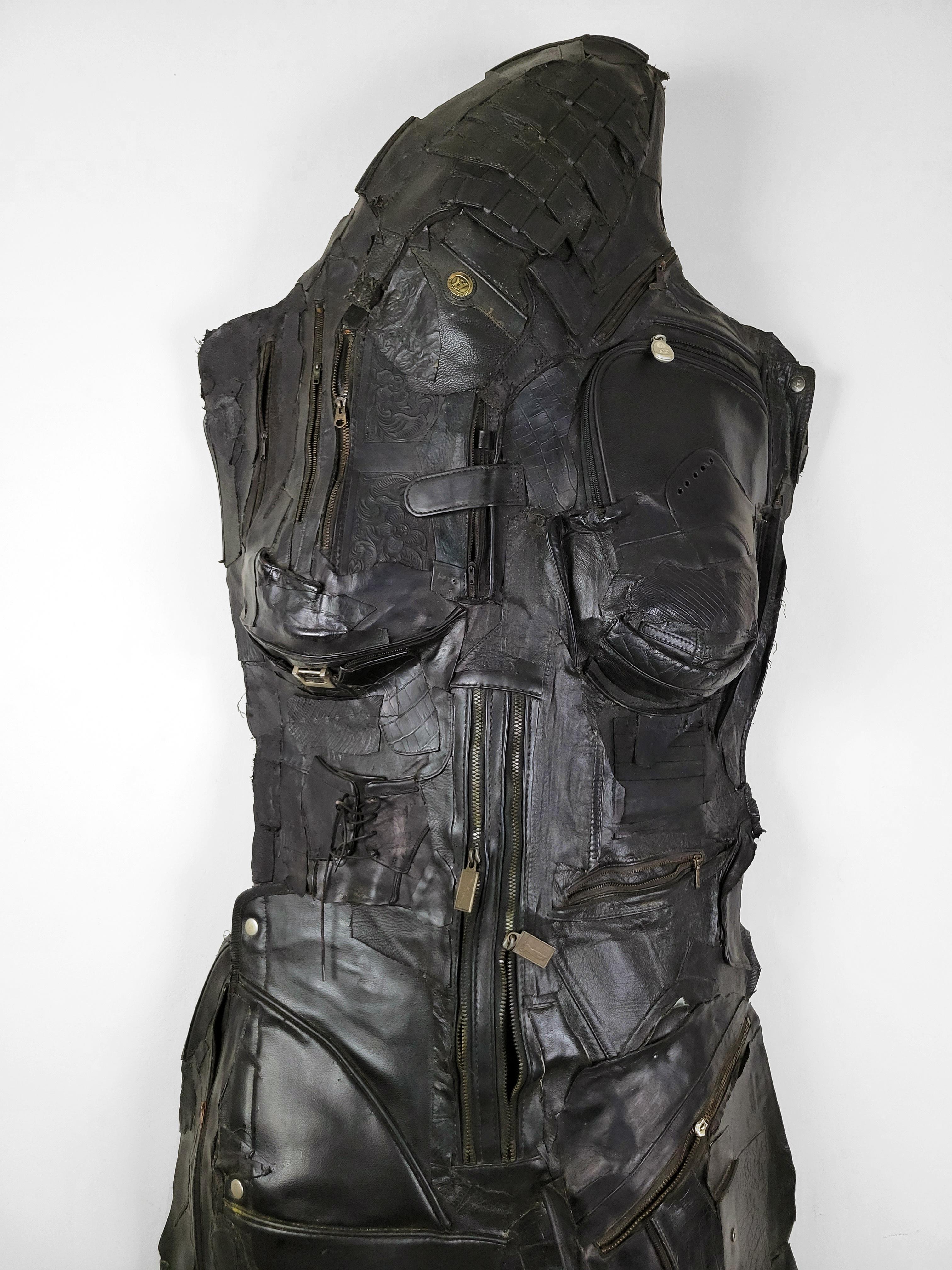 Linda Stein, Guardian 697 - Feminist Contemporary Black Leather Metal Figurative Wall Sculpture 

Guardian 697 from Linda Stein’s Knights of Protection series functions both as a defender in battle and a symbol of pacifism.  The series references