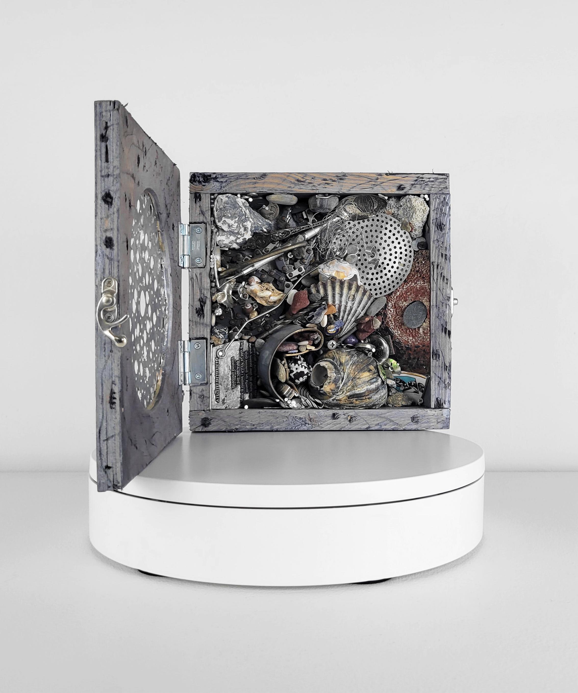 Linda Stein, Case 899 - Contemporary Art Mixed Media Wunderkammer Sculpture

This work from Linda Stein's Displacement From Home series draws from the tradition of wunderkammer/cabinets of curiosities to highlight the global displacement and