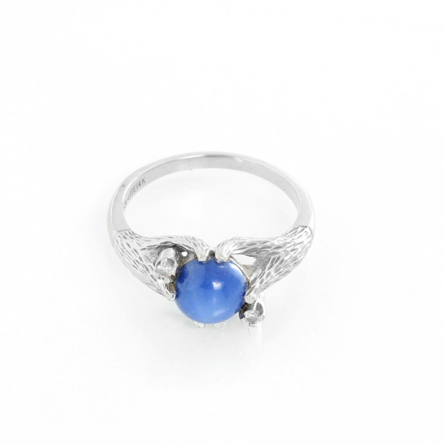 Linde Lindy Corn Flower Blue Star 14K Gold Ring - Solitare blue sapphire set in 14K white gold with cubic Zirconia on side. Size 9.