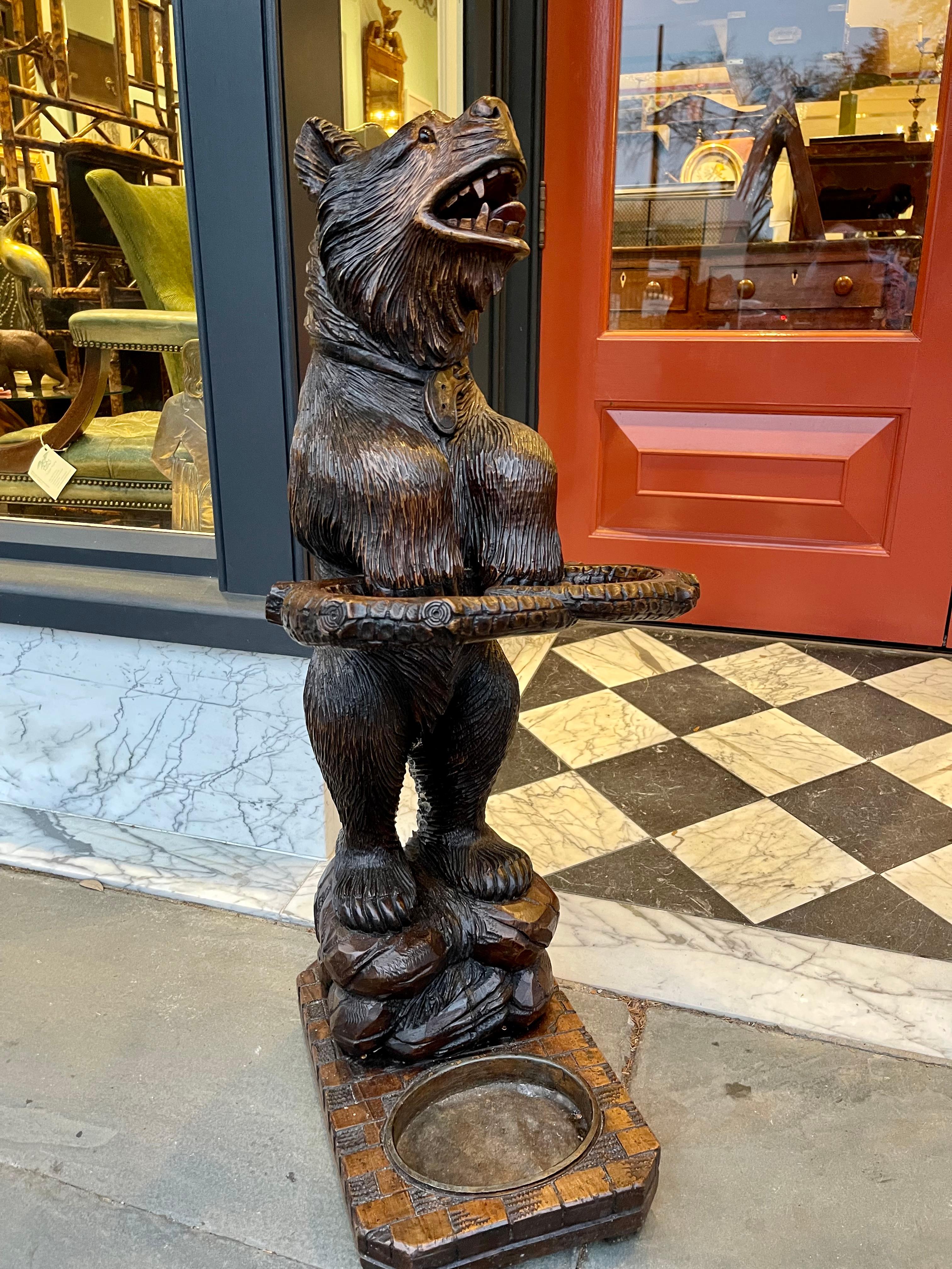 Linden wood umbrella stand in form of a standing bear on base late 19th century.