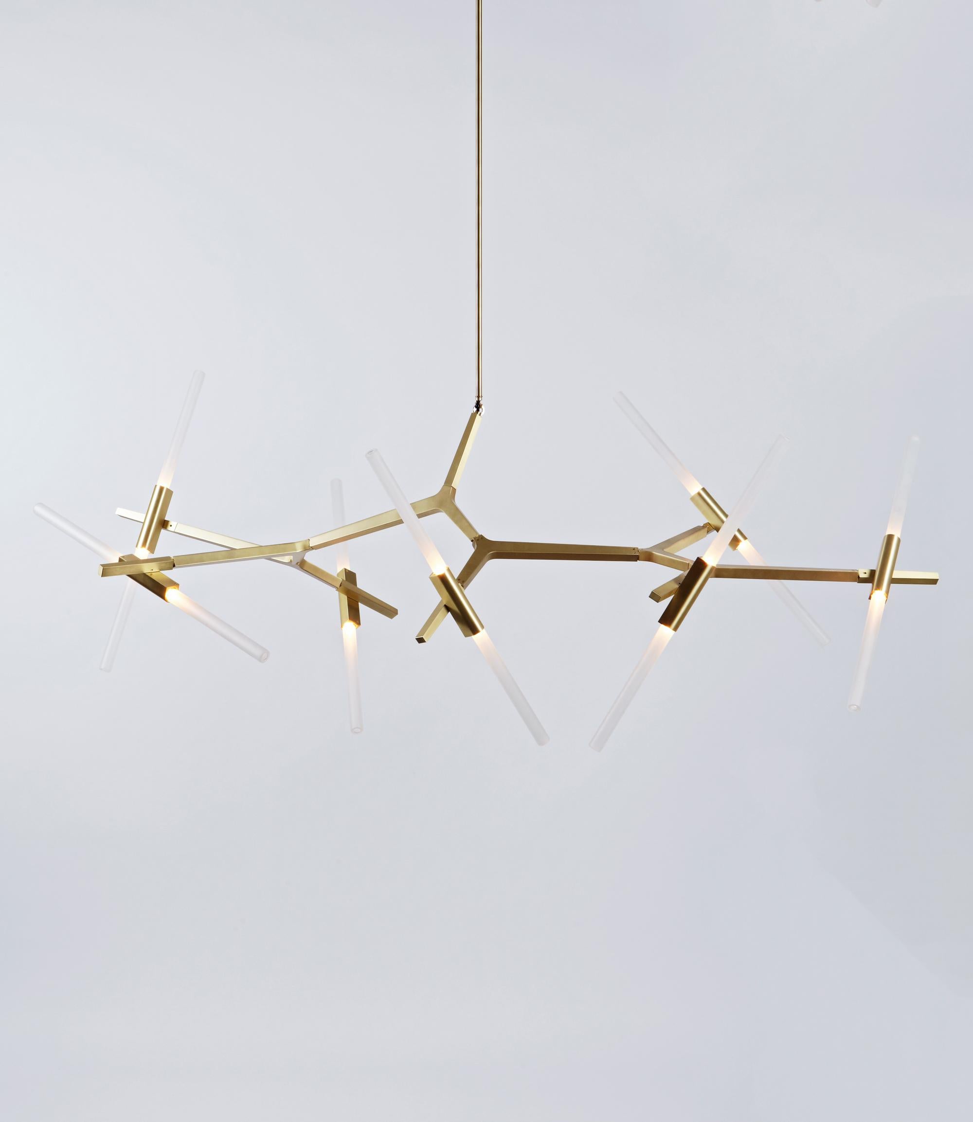 Agnes is a modular metal structure composed of anodized aluminum hardware and white glass shades. Articulating joints allow the bulbs to orient in various ways, ranging anywhere from orderly to chaotic. Originally conceived as a candelabra, Agnes