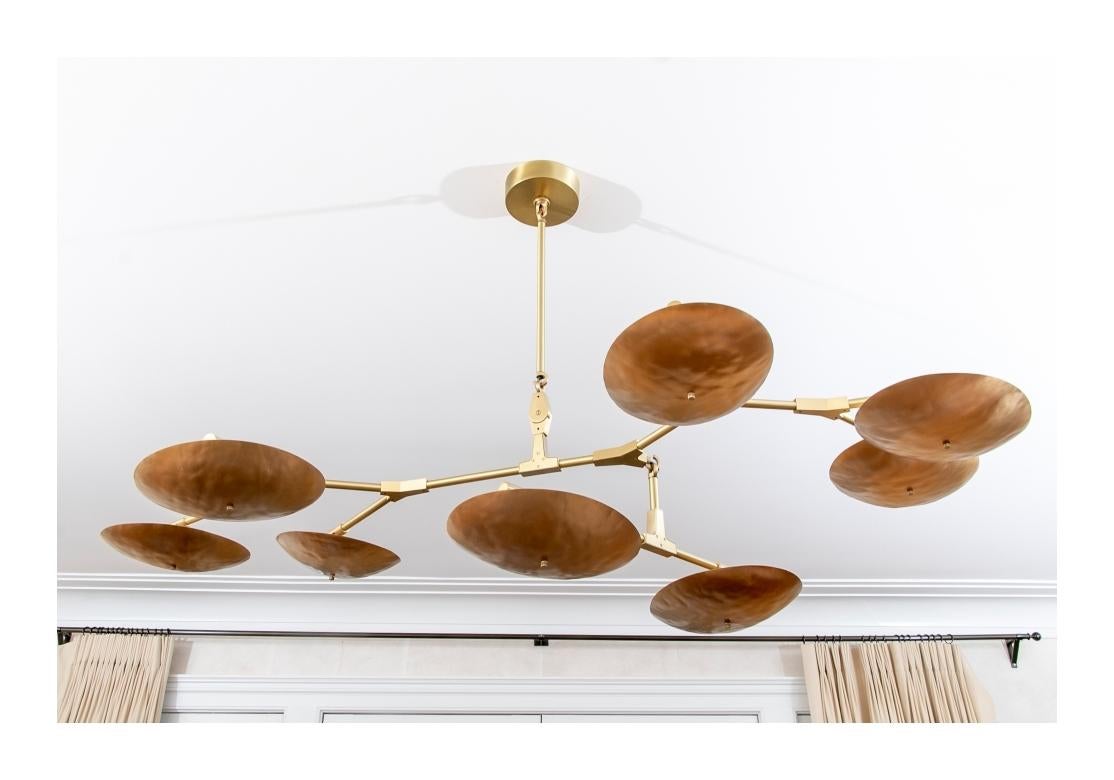 Spectacular Mobile-Like creation from New York Artist and Designer Lindsay Adelman. Dynamic and striking mixed Metal brushed hammered bronze branching disc chandelier with brushed brass hardware.
Dimensions: 11