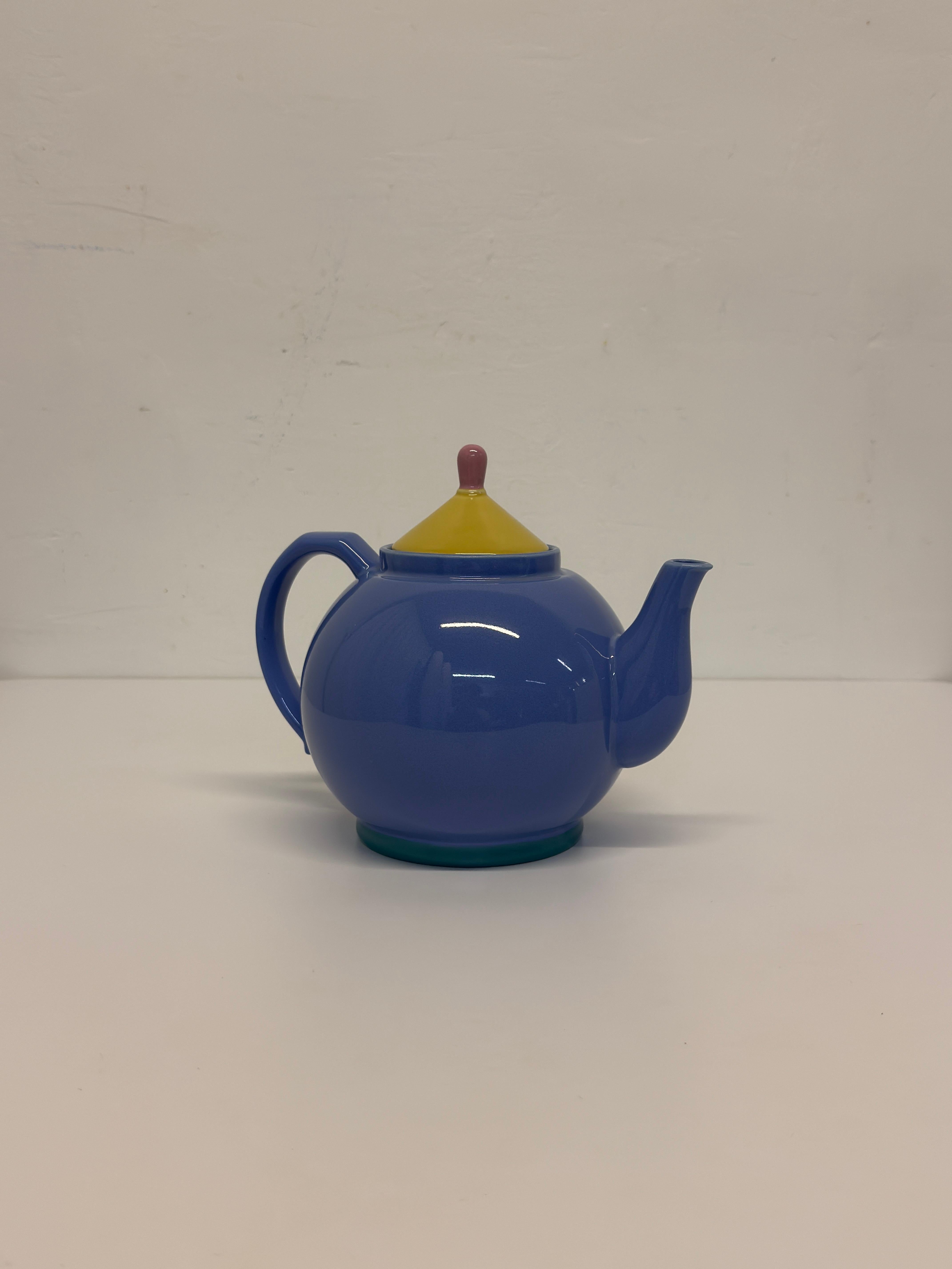 Postmodern tea kettle from the 1980s by Lindt-Stymeist in baby blue, yellow and pink.