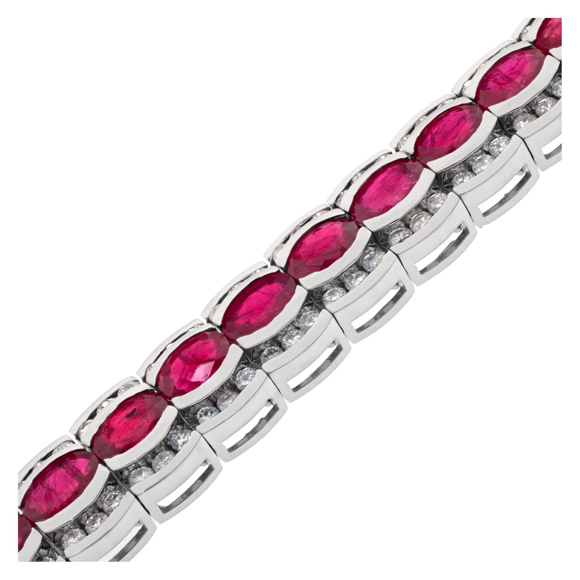 Ruby and diamond line bracelet in 14k white gold. round brilliant cut diamonds total approx. weight: 4 carats, estimate: G-H color, VS-SI clarity. Oval cut rubies total approx. weight: 17.10 carats. Length: 7 inches. Witdth: 10mm.