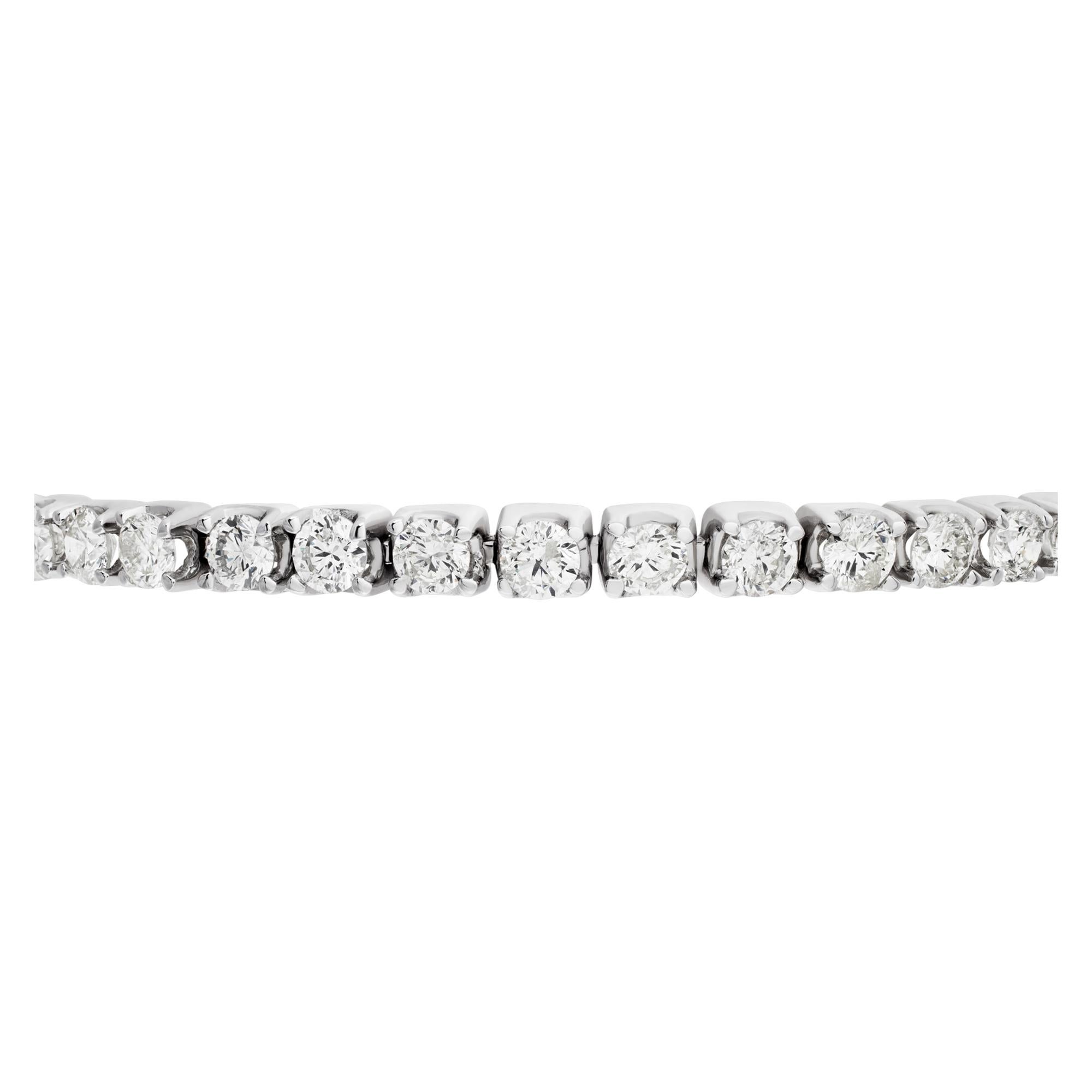 Sparkling line diamond bracelet with 8.09 carat full cut round diamonds set in 14K white gold- Diamonds estimate: H/I color, SI clarity. Length 7.5 inches.