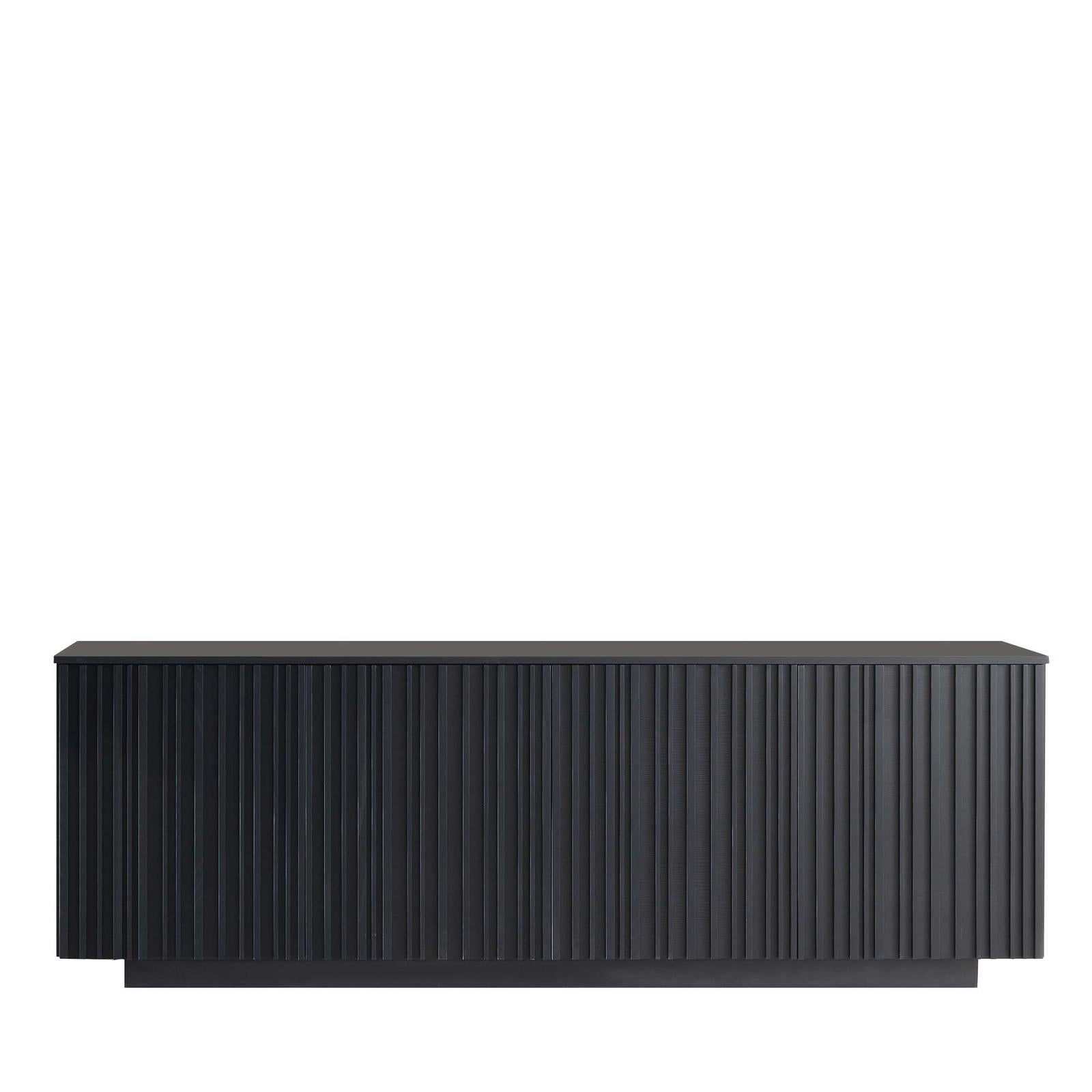 Resting on a smaller wooden base, this exquisite, black, rectangular sideboard by Giuliano Cappelletti focuses on the geometrical elements of the line, whose almost hypnotic, vertical repetition on the sideboard's front doors undoubtedly lends this