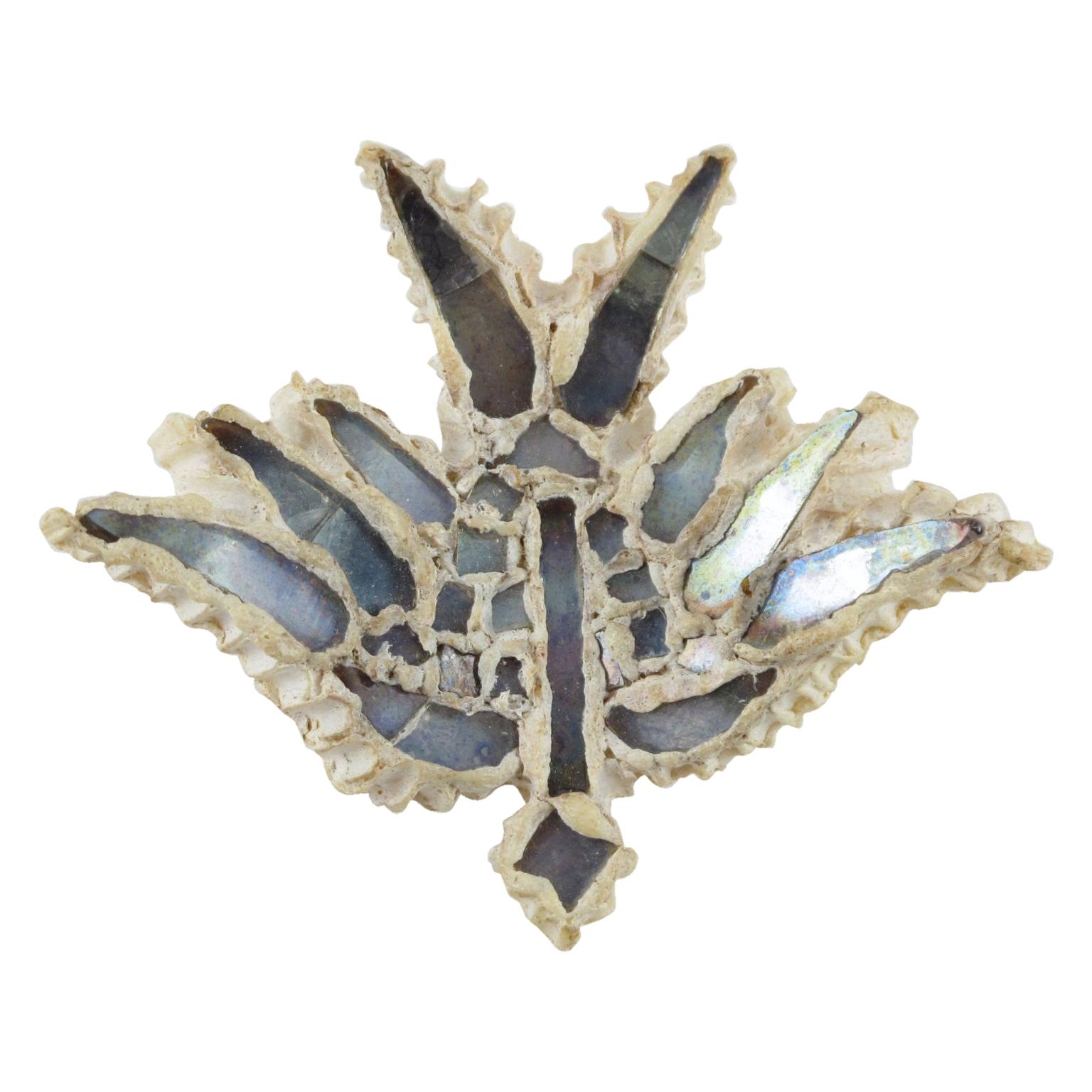 Beautiful Line Vautrin Talosel or resin bird brooch pin. Off-white resin encrusted with blue-colored mirrored glass on a flying bird shape. Glass and Talosel, a technique created by Line Vautrin, in which she used cellulose acetate that was
