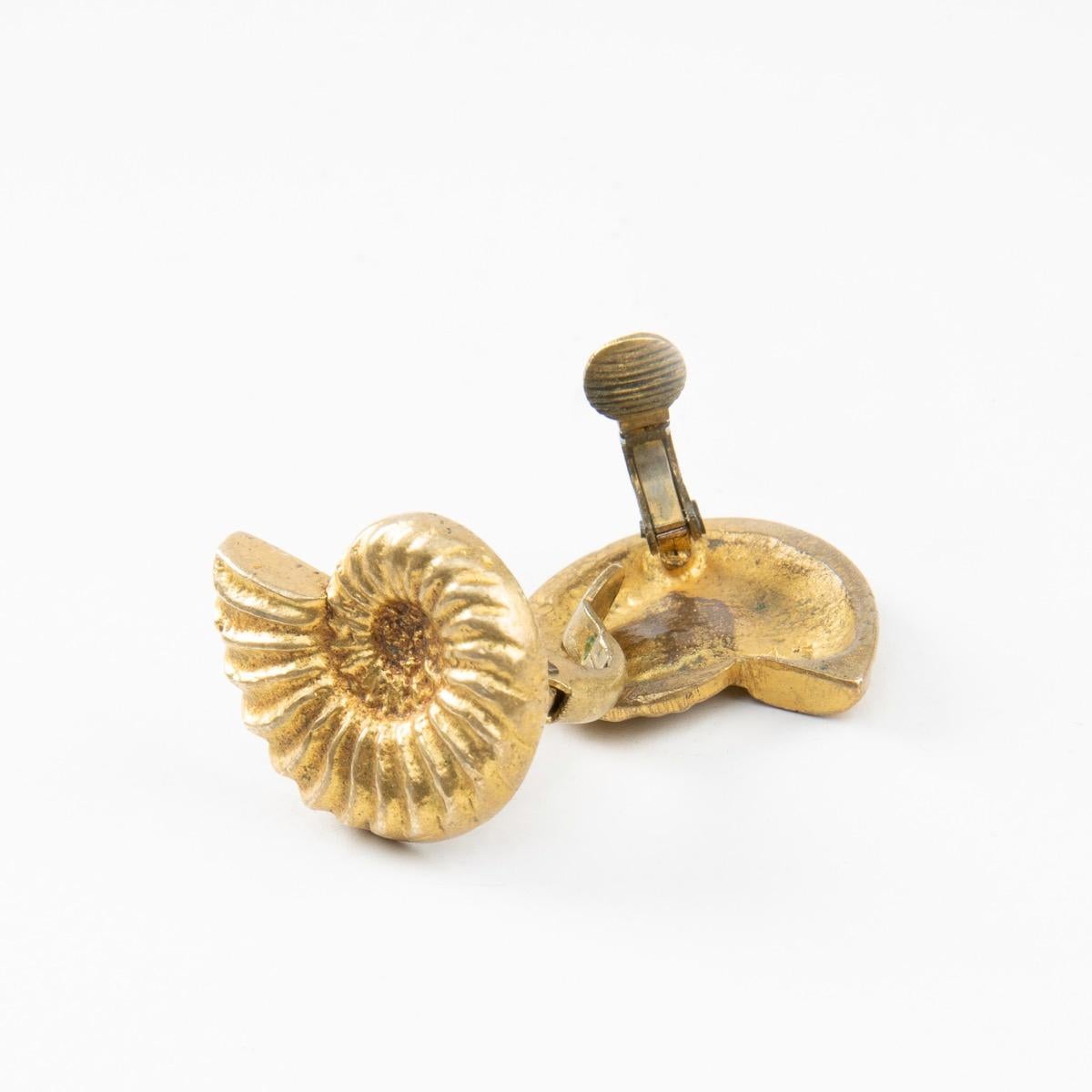 The earrings are composed of a gilded bronze structure with a nice nautile shape.
These pieces has been designed and produced in the beginning of the 1960s.
Each is signed 
