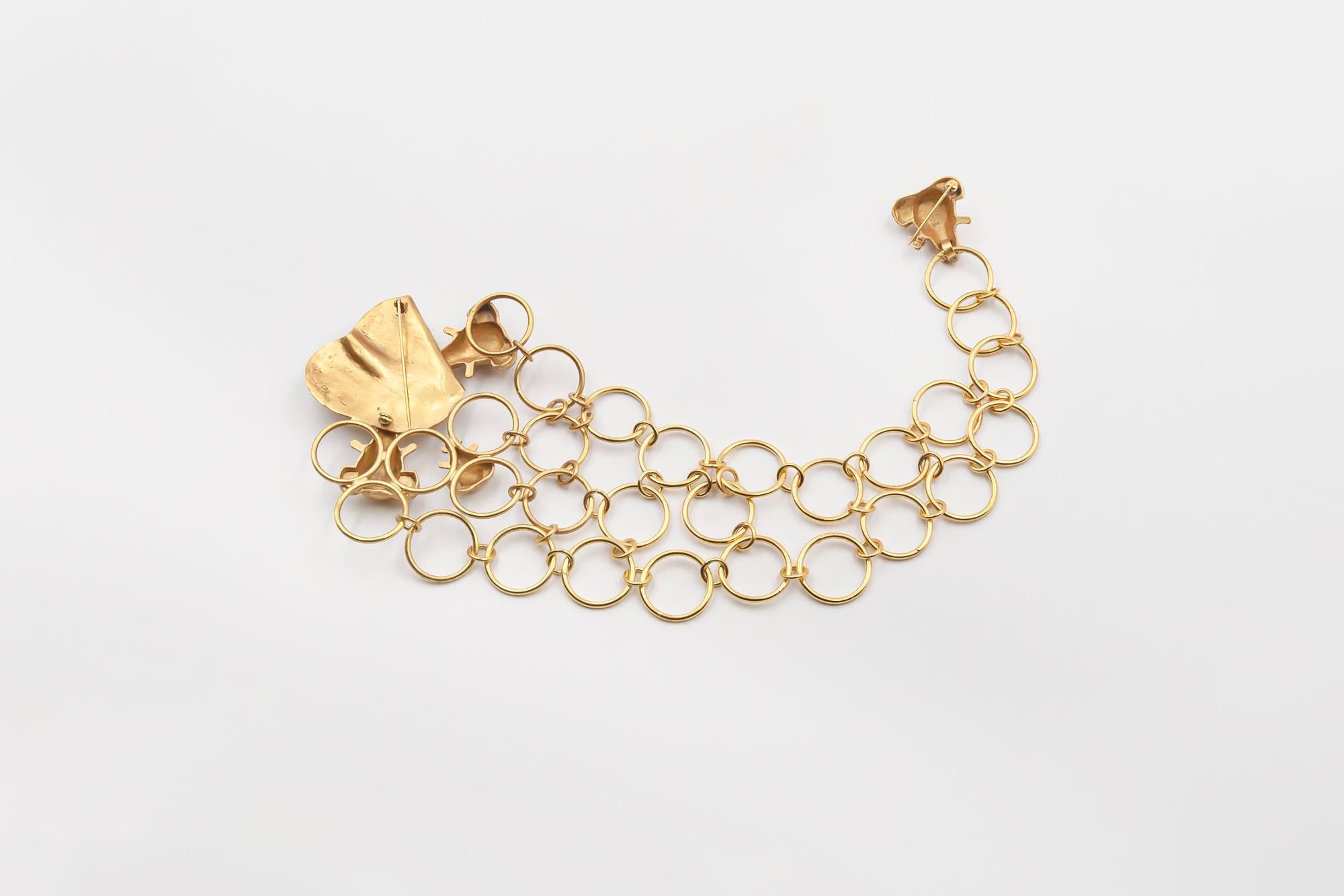 Very rare double pin brooch linked with 3 chains by French artist Line Vautrin.

Line Vautrin was a French jewelry maker, designer, and decorative artist. Best known for her uncategorizable manufacture of objects and jewelry, Vautrin’s practice