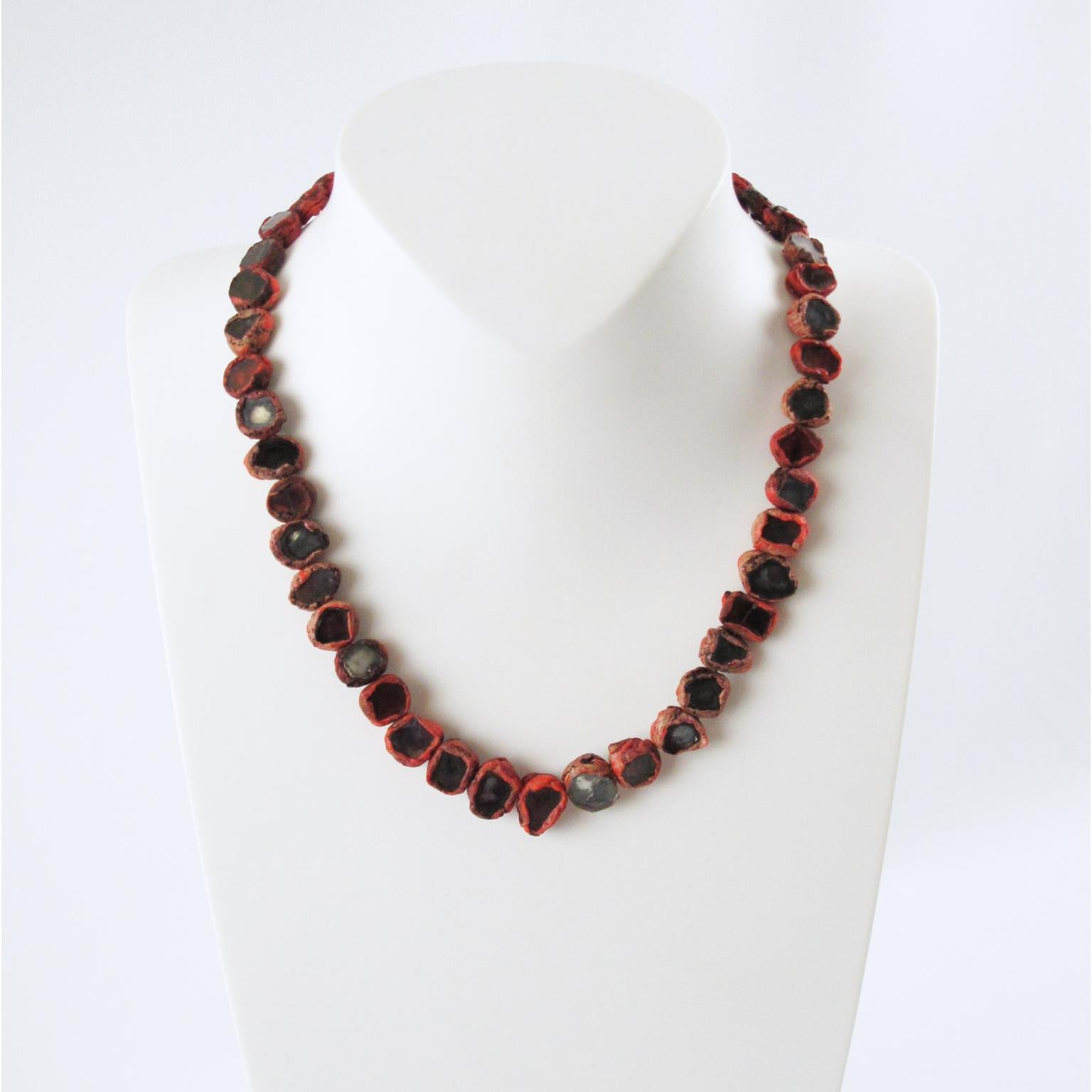 Elegant 1960s Talosel Resin necklace by Line Vautrin, Paris. Red-colored resin or Talosel necklace with encrusted tinted mirrors.
Glass and Talosel, a technique created by Line Vautrin, in which she used cellulose acetate that was fractured into