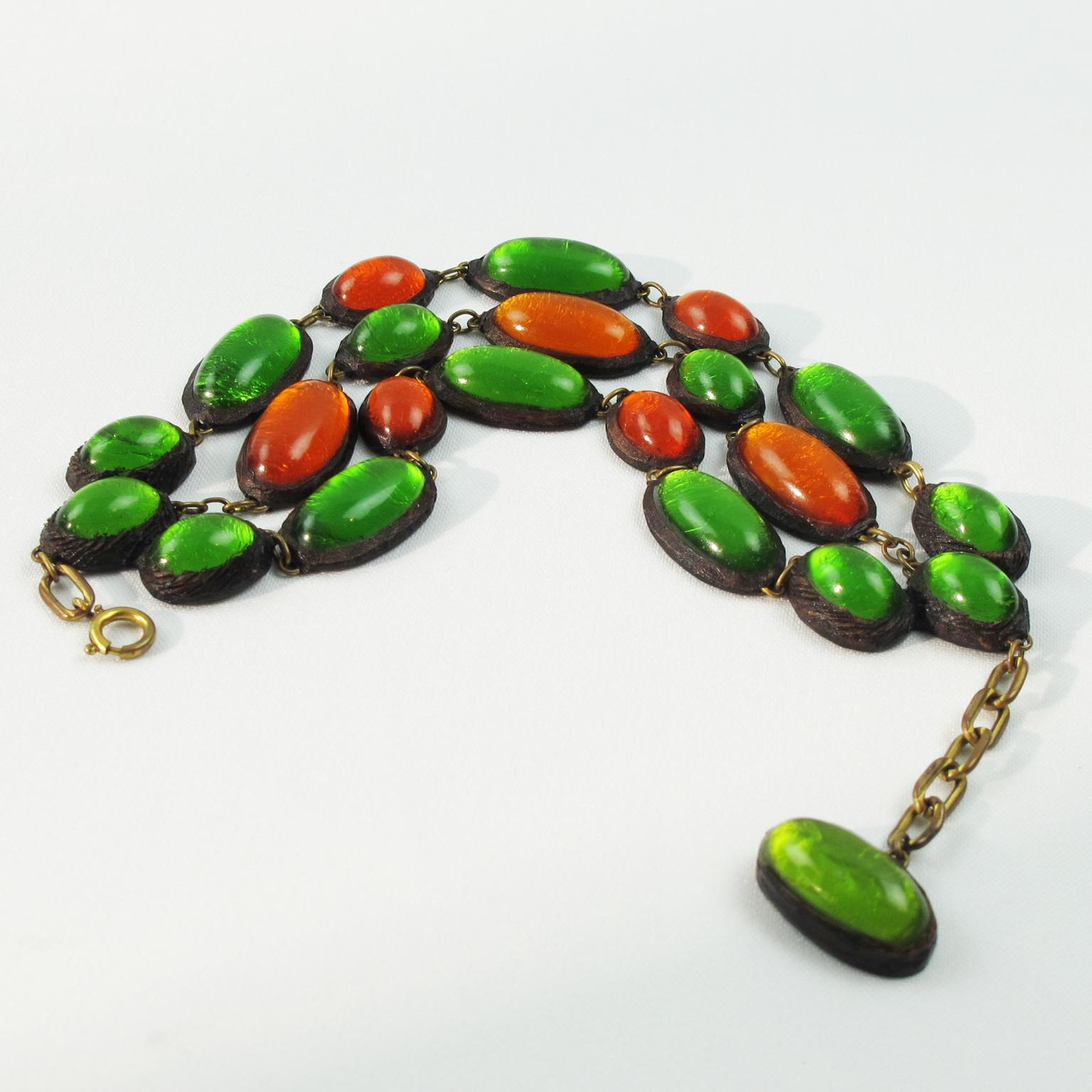 This lovely Talosel link bracelet was crafted by one of Line Vautrin's students in the 1970s. The brown Talosel or resin geometric multi-strand shape is encrusted with green and orange cabochons on a silver foil background. The piece boasts a