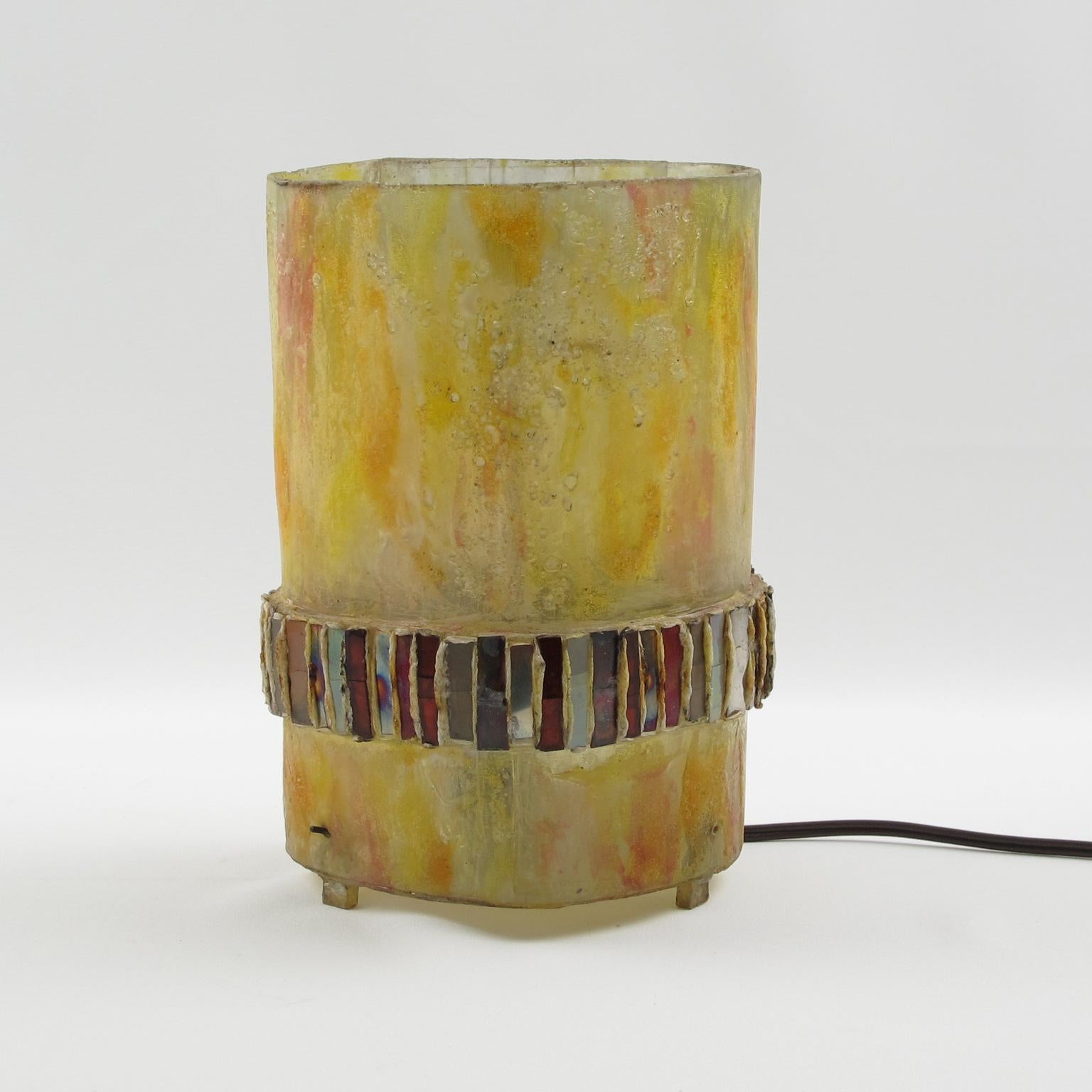 This rare Talosel and mirror table lamp or sconce was executed by one of the students of Line Vautrin (1913 - 1977) circa 1960. This marvelous table lamp features pearlized yellow resin ornate with a decoration band of small pieces of mirrored glass