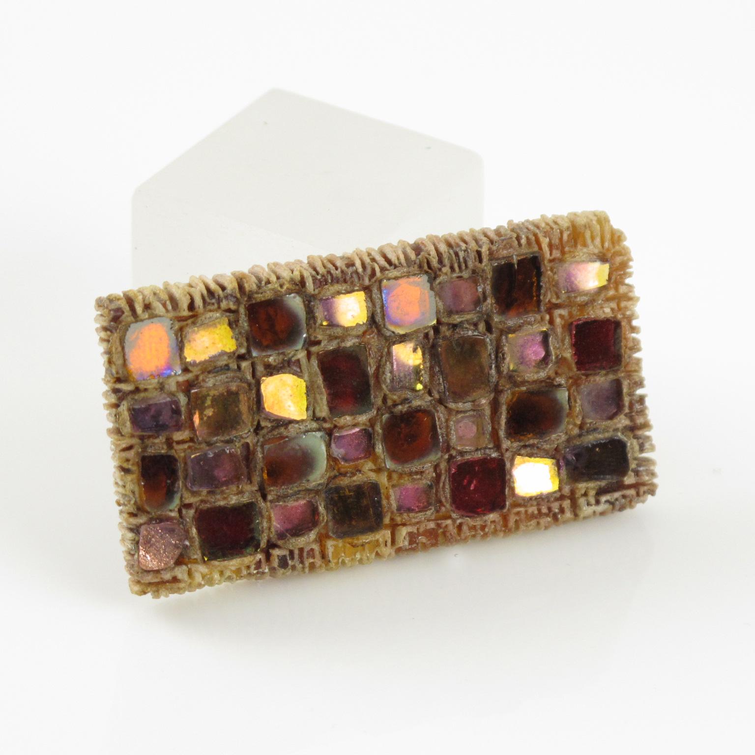This stunning Line Vautrin geometric Talosel brooch pin features an encrusted rectangular shape with pink-colored mirrored glass in a checkerboard pattern. The glass associated with Talosel is a unique technique created by Line Vautrin, in which she
