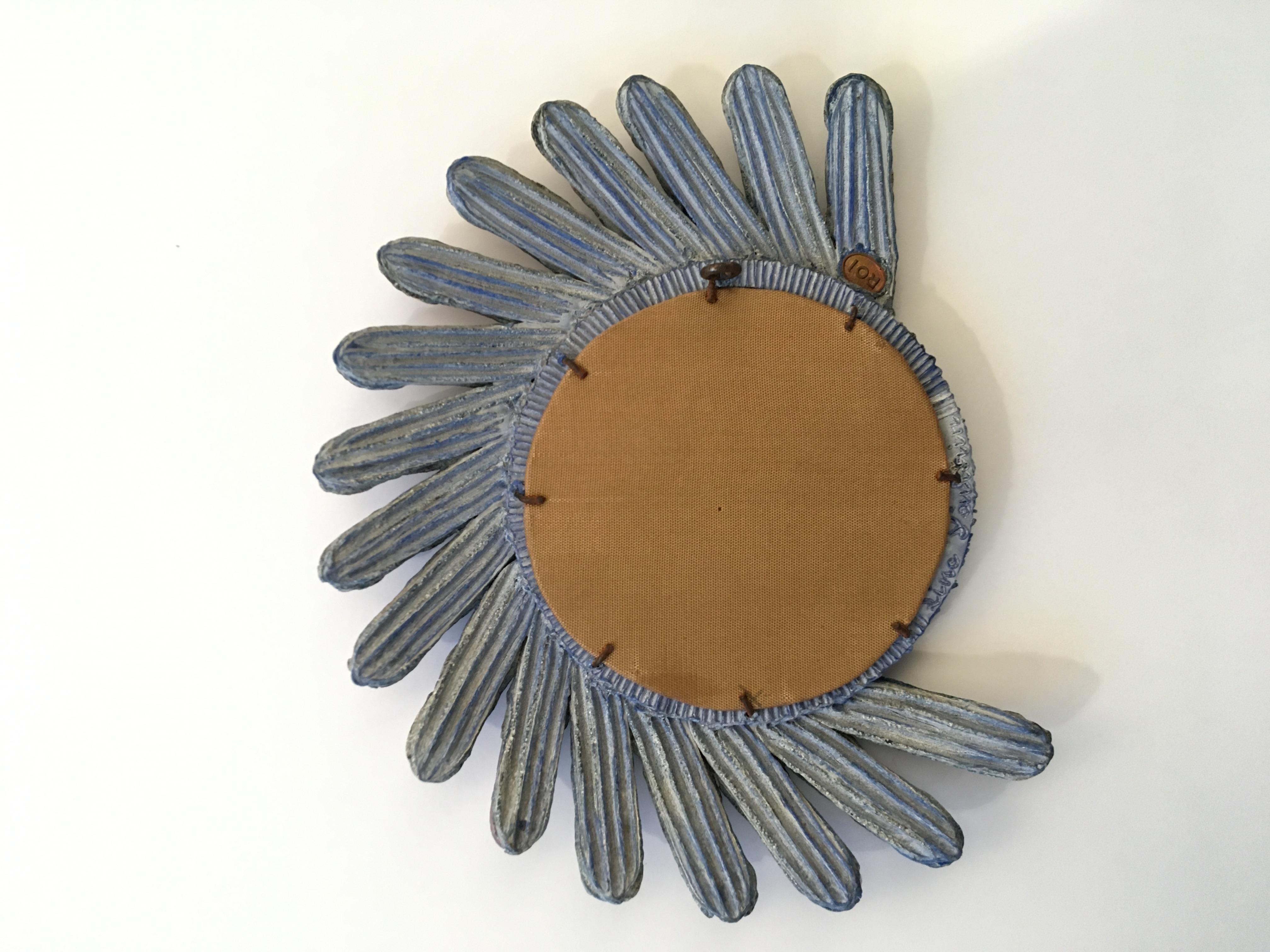 Unique aux exceptional asymmetrical mirror with a blue talosel resin frame.
The petals are also in blue talosel resin with inlaid purple mirrors.
Original back canvas.
Signed Line Vautrin on the back on the circular frame and stamped ROI on the back