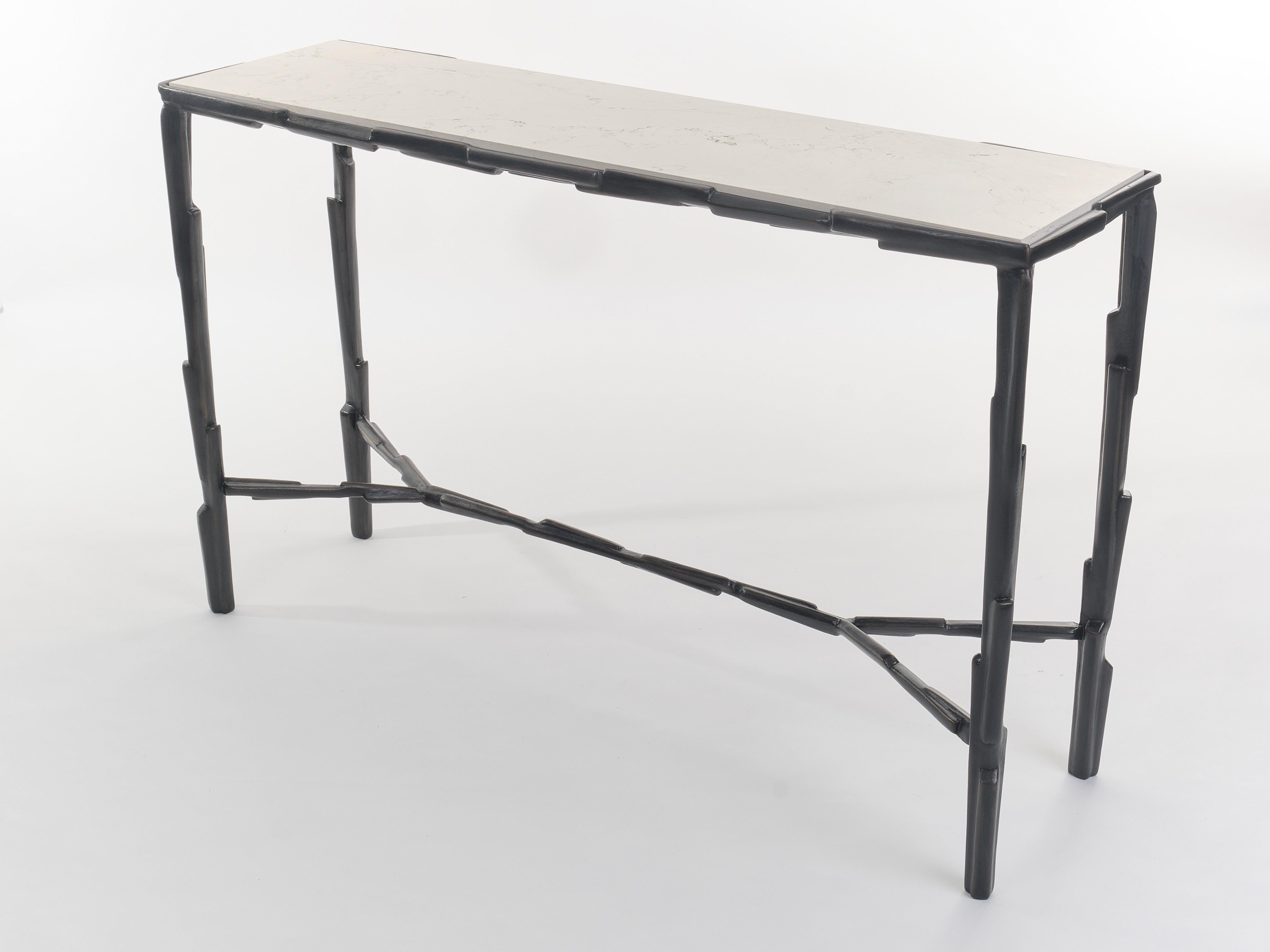 Hand-sculpted in plaster and unique with its bronze patina, the Linea No.2 Console Table is characterised by its clean, sculptural aesthetic. This piece of furniture is crowned with a Biancone marble top, which is set in a hand-sculpted frame. The