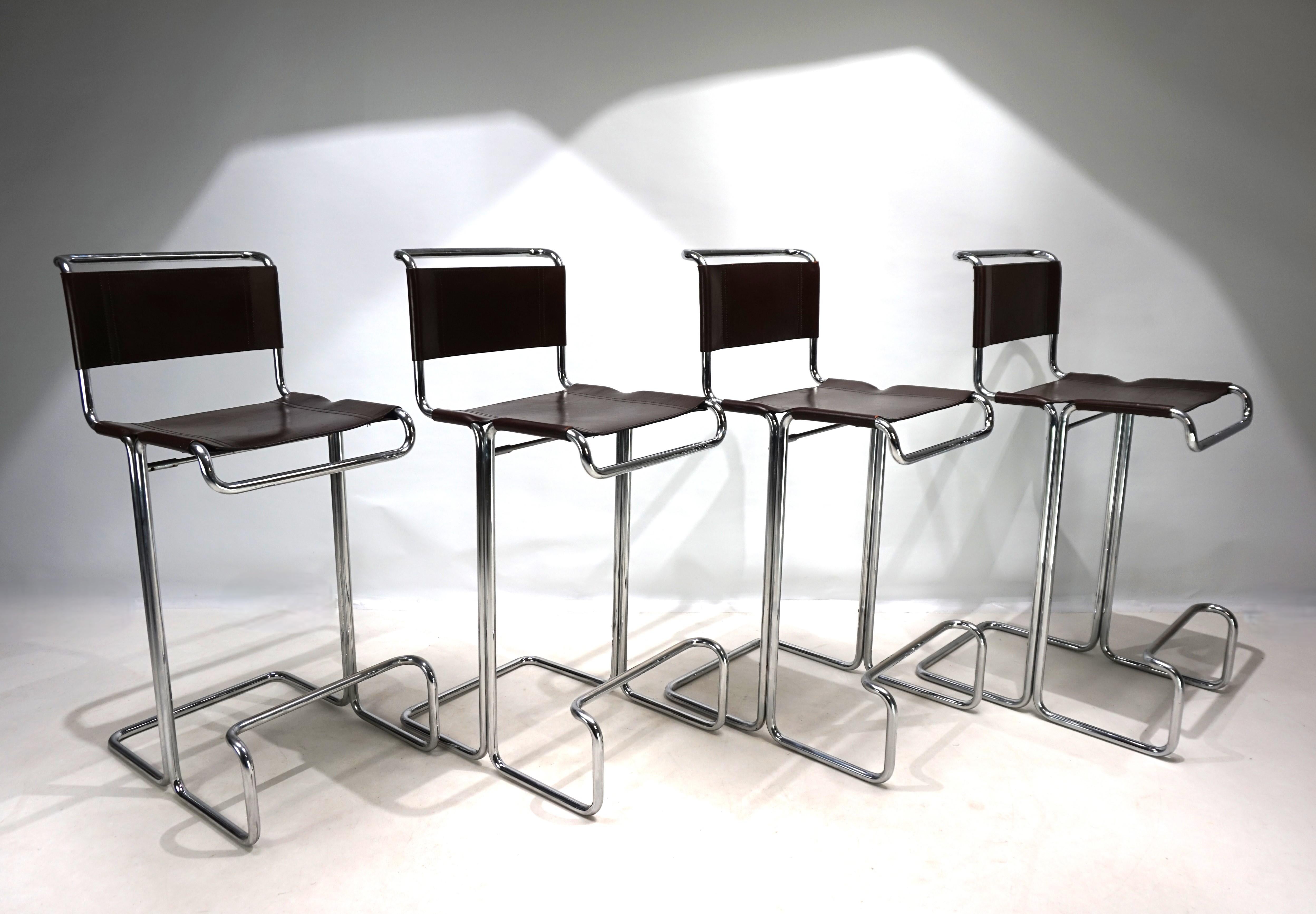 This set of four bar stools with tubular steel frames and thick saddle leather by Linea Veam is in the Bauhaus style. The chairs' extremely attractive curved tubular steel frames with saddle leather seats and backrests were inspired by Marcel