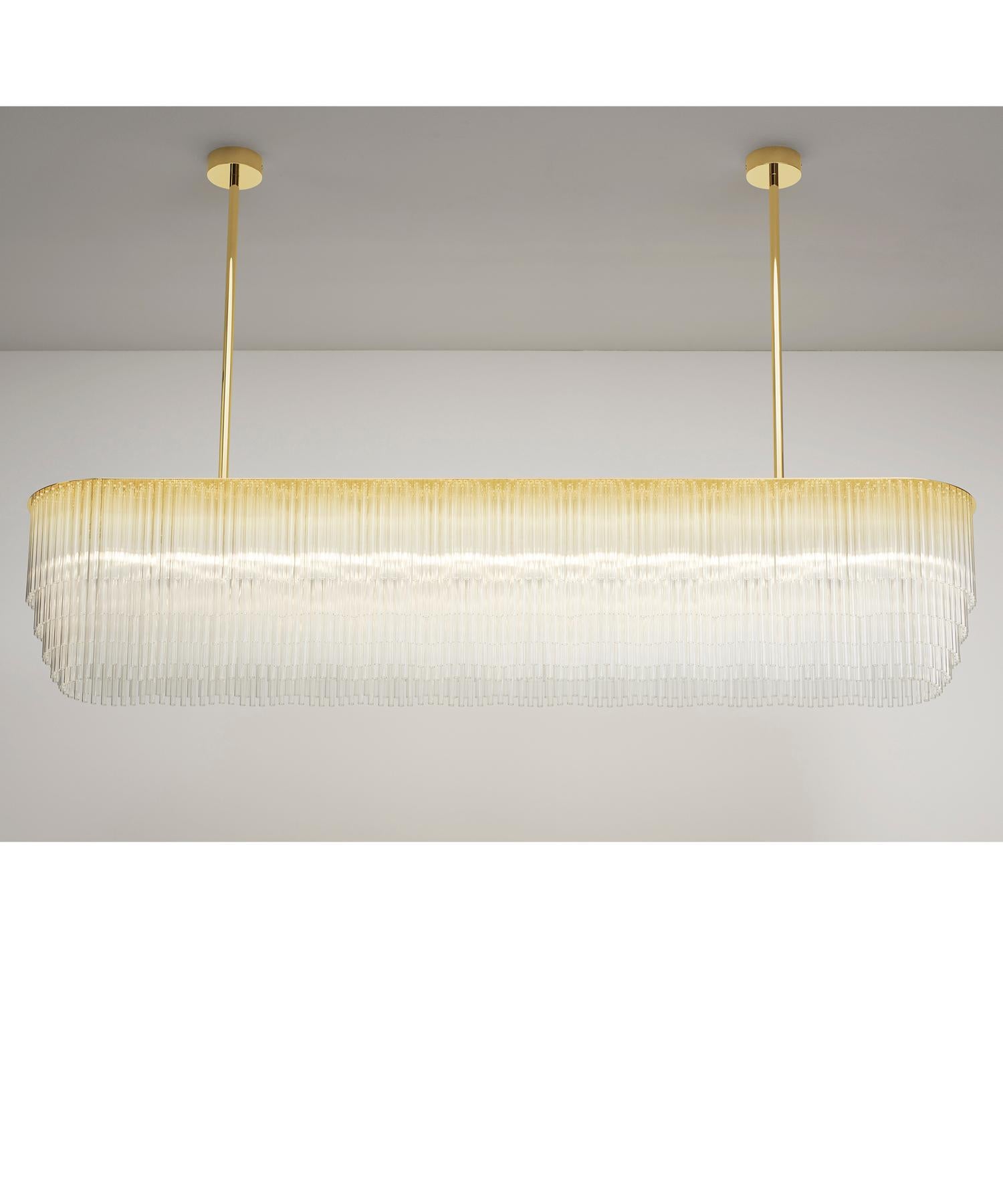 The Linear Chandelier, with its distinguished tiered-glass profile is the perfect solution for interiors that require a contemporary and functional source of light. It sits beautifully when suspended over dining tables or as a decorative accent in a