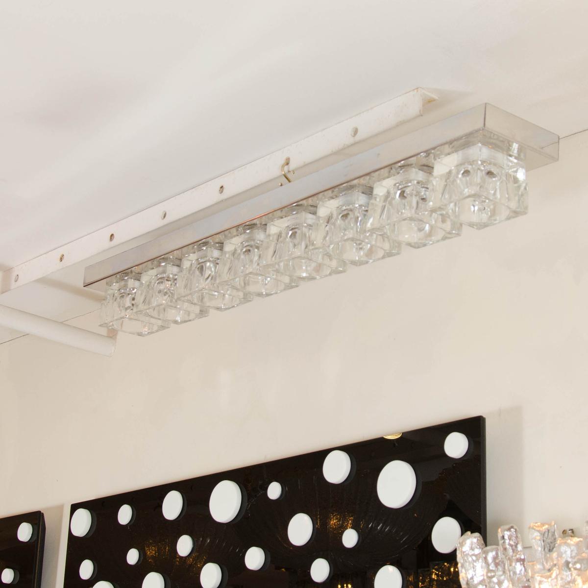 Linear chrome flush mount ceiling fixture composed of 10 glass cubes by Mazzega.