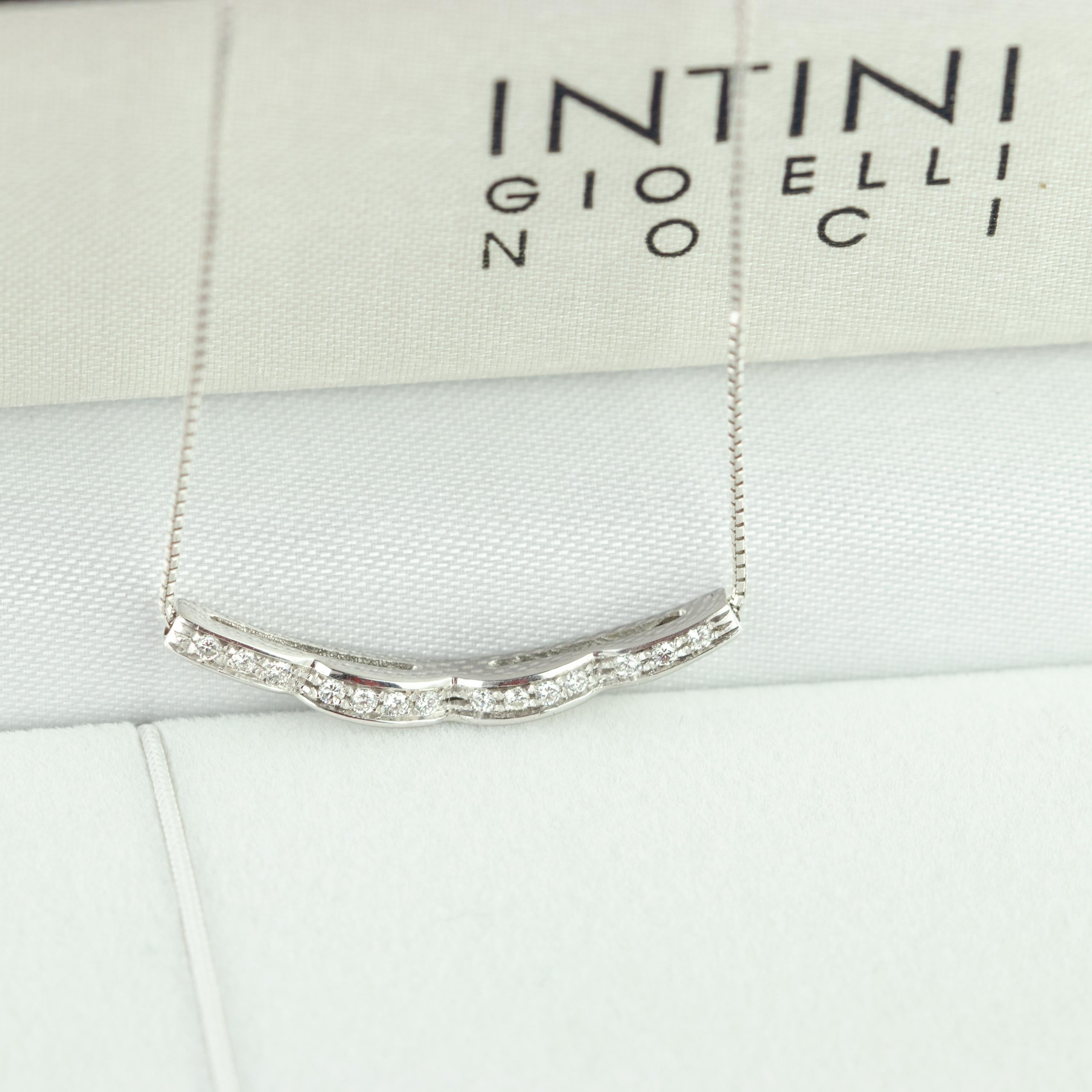 Stunning and marvelous linear curved horizontal diamond line pendant embellished by 18 karat carved white gold chain. Over 14 diamonds, 0.14 carat, create a line of gems crafted carefully to be as delicate as a royal jewel. A magnificent bar chain