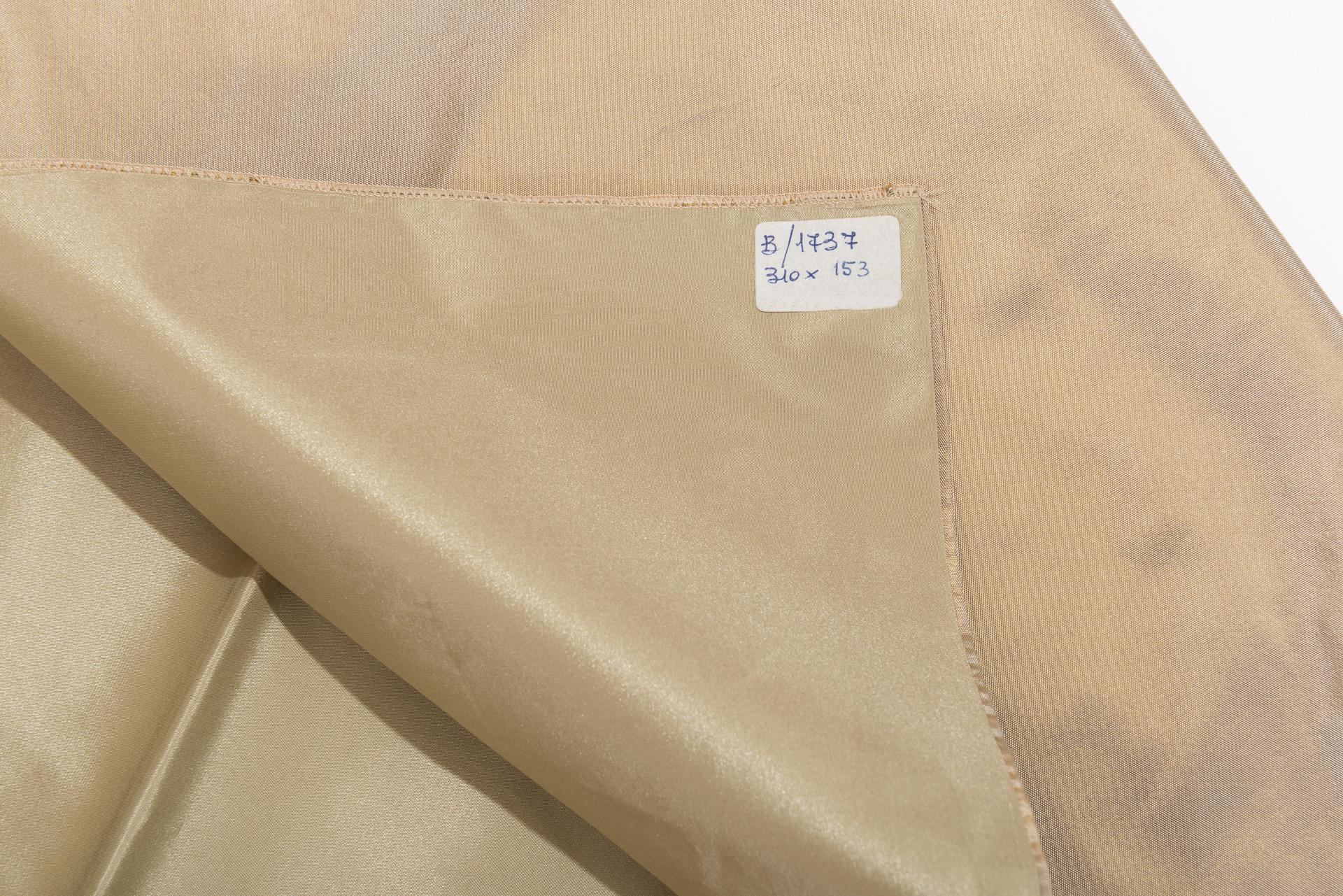 Long elegant cream-colored silk curtain with decoration on the bottom, fully lined.
You can match it with another one of a more intense shade, but with the same design, published on 1stdibs with the same name.
By the famous Fischbacher in Swiss.