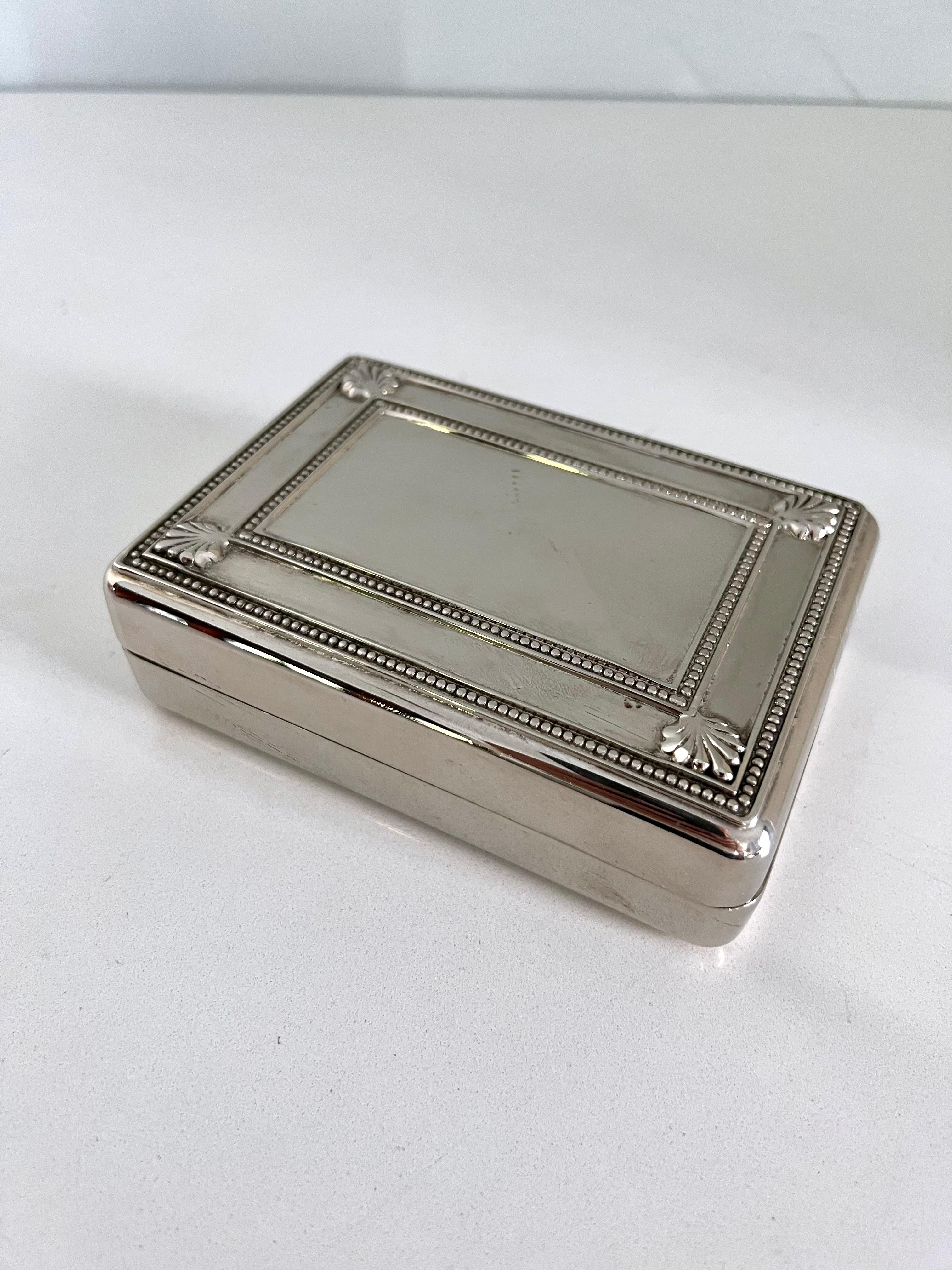 Superb silver box with velvet lining and a nice weight to it. A large rectangle perfect for engraving on the top. Box opens and closes easily. 

This box is compliment to any table or vanity, ideal for jewelry thanks to the soft lining. Can be