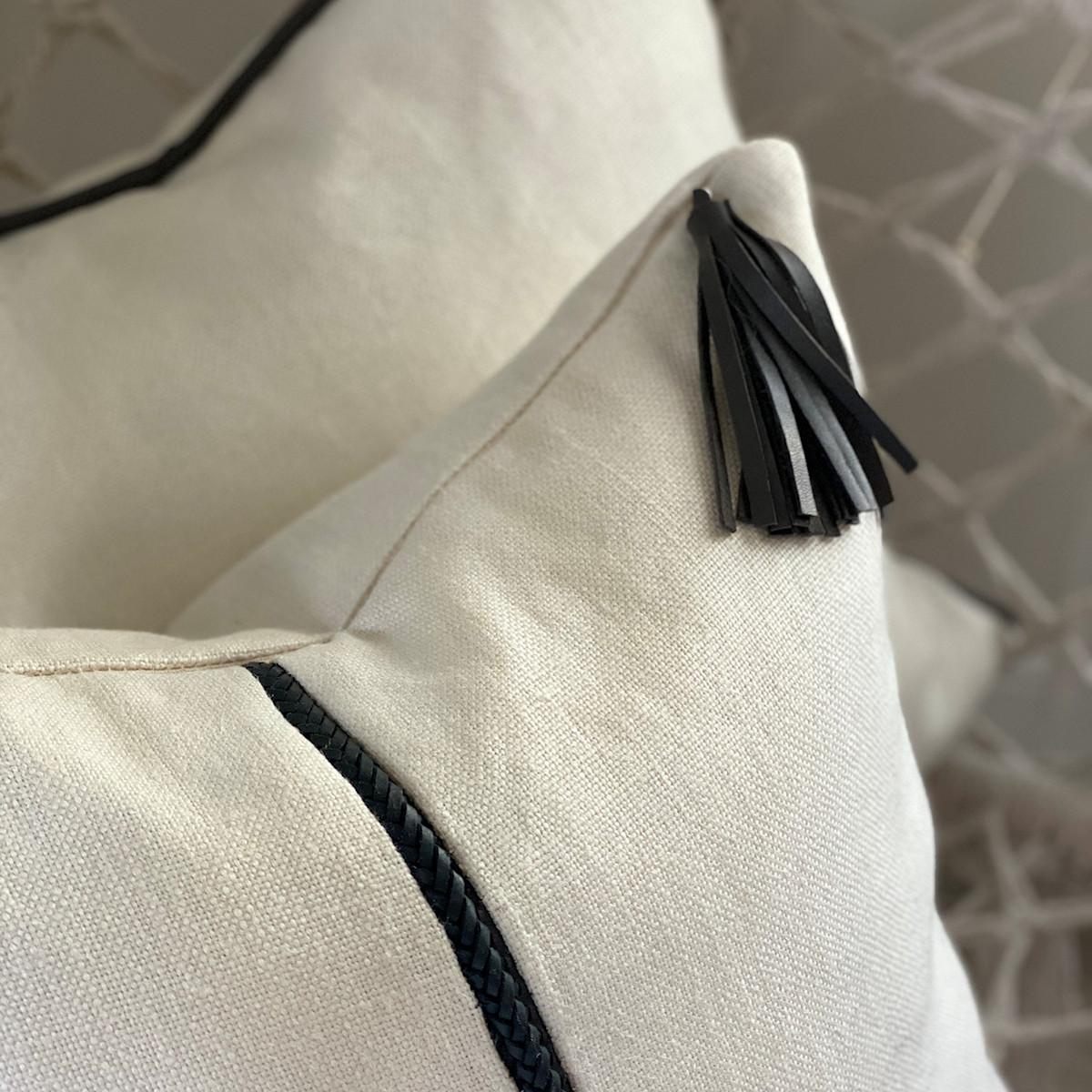 Designed by Australian Designer, Emily Barbara this captivating 100% linen pillow features an intricate handwoven kangaroo leather detailing complimented with a sophisticated soft leather hanging tassel. The combined usage of textured linen and