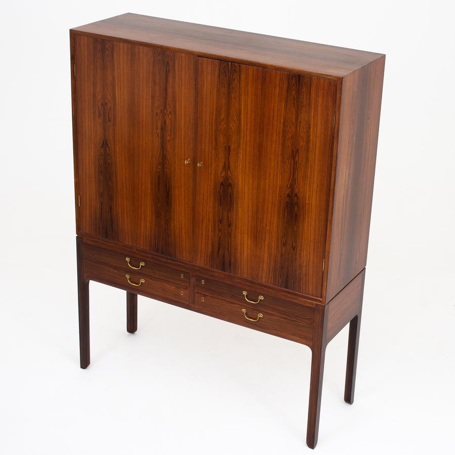 Linen-press in rosewood with two doors and four drawers, brass handles. Maker A. J Iversen.