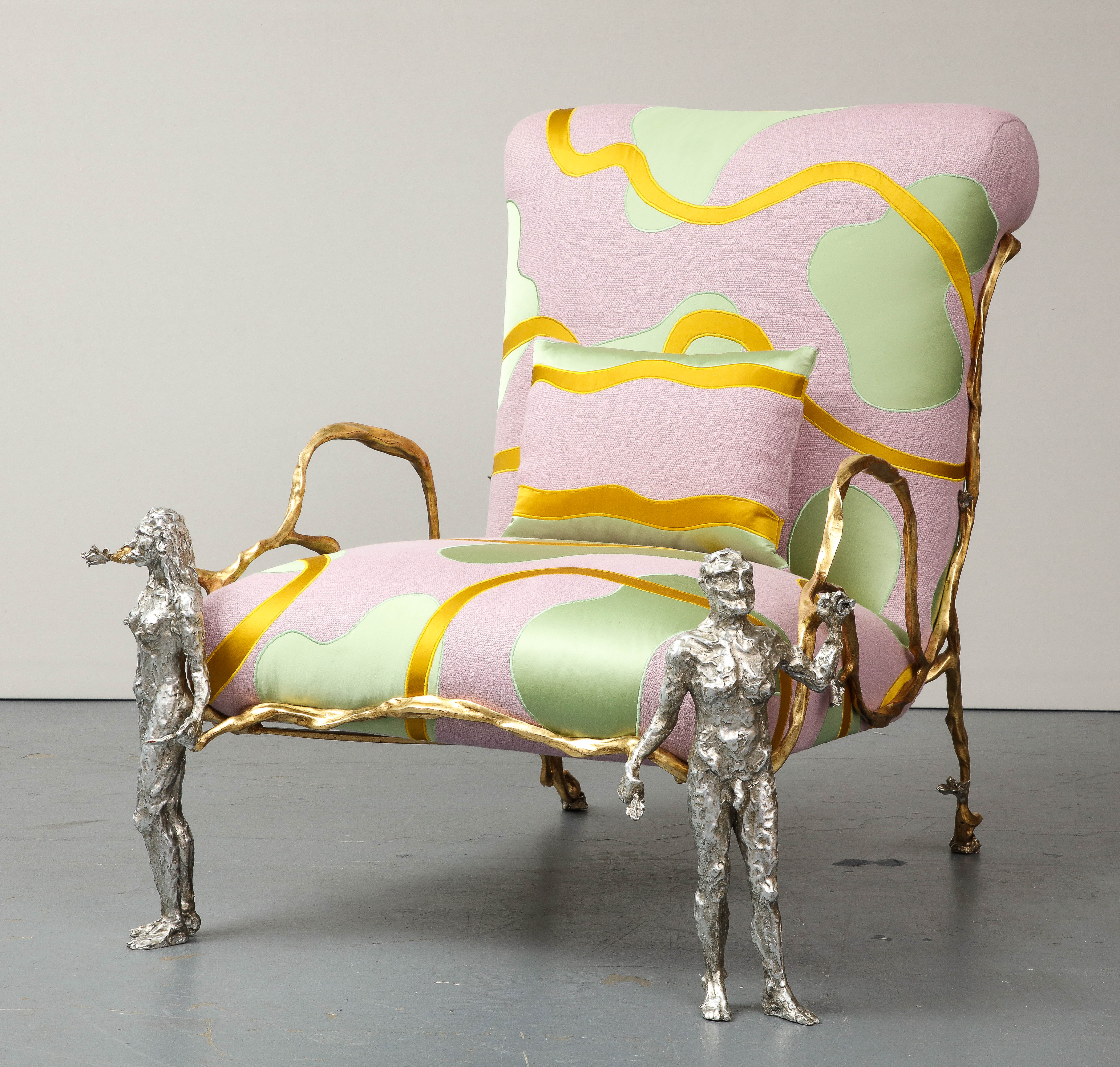 Playful and unique armchair by Mattia Bonetti. Bonetti employs a neo-baroque sensibility and attention to material and color in this staggering chair.

Silver gilded cast bronze with gold gilt frame; linen with silk satin appliqué upholstery.