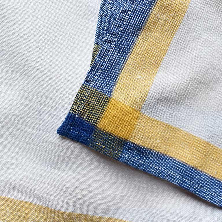 Set of six square blue, yellow and cream cloth dinner napkins. This set reminds of summers in Nantucket. Each napkin is surrounded by a border of blue and yellow at the sides. Ends are stitched. These cloth napkins would be great for a dinner party,