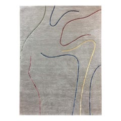 "Lines" , tappeto trapuntato a mano in 100pct lana, tema grigio, linee di seta colorate, tappeto