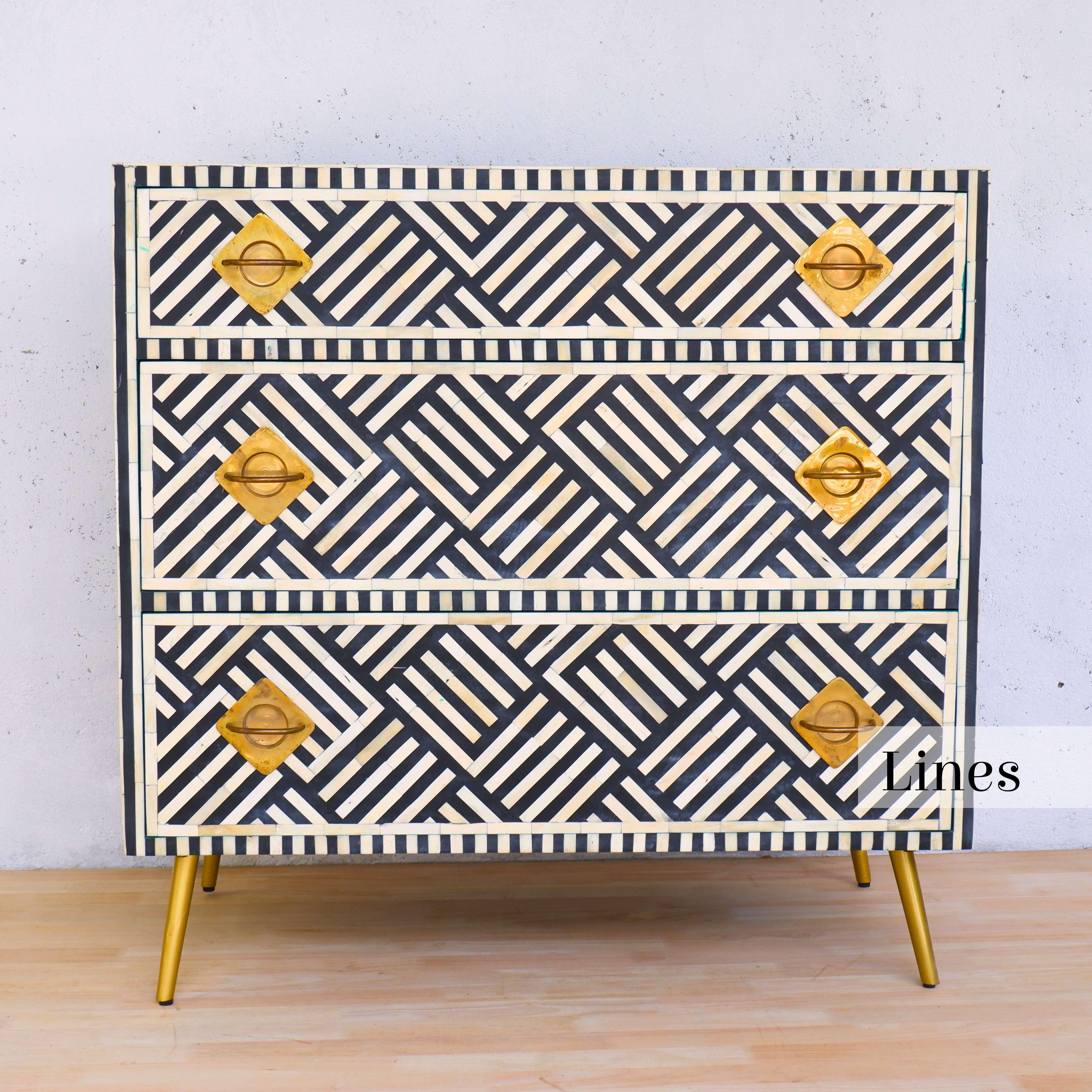 Elevate your home with Artisanal's exquisite black-and-white three - drawer inlay chest—a stunning addition that seamlessly blends timeless craftsmanship with modern sophistication.

Adorned with intricate geometric-stripe patterns, this dresser