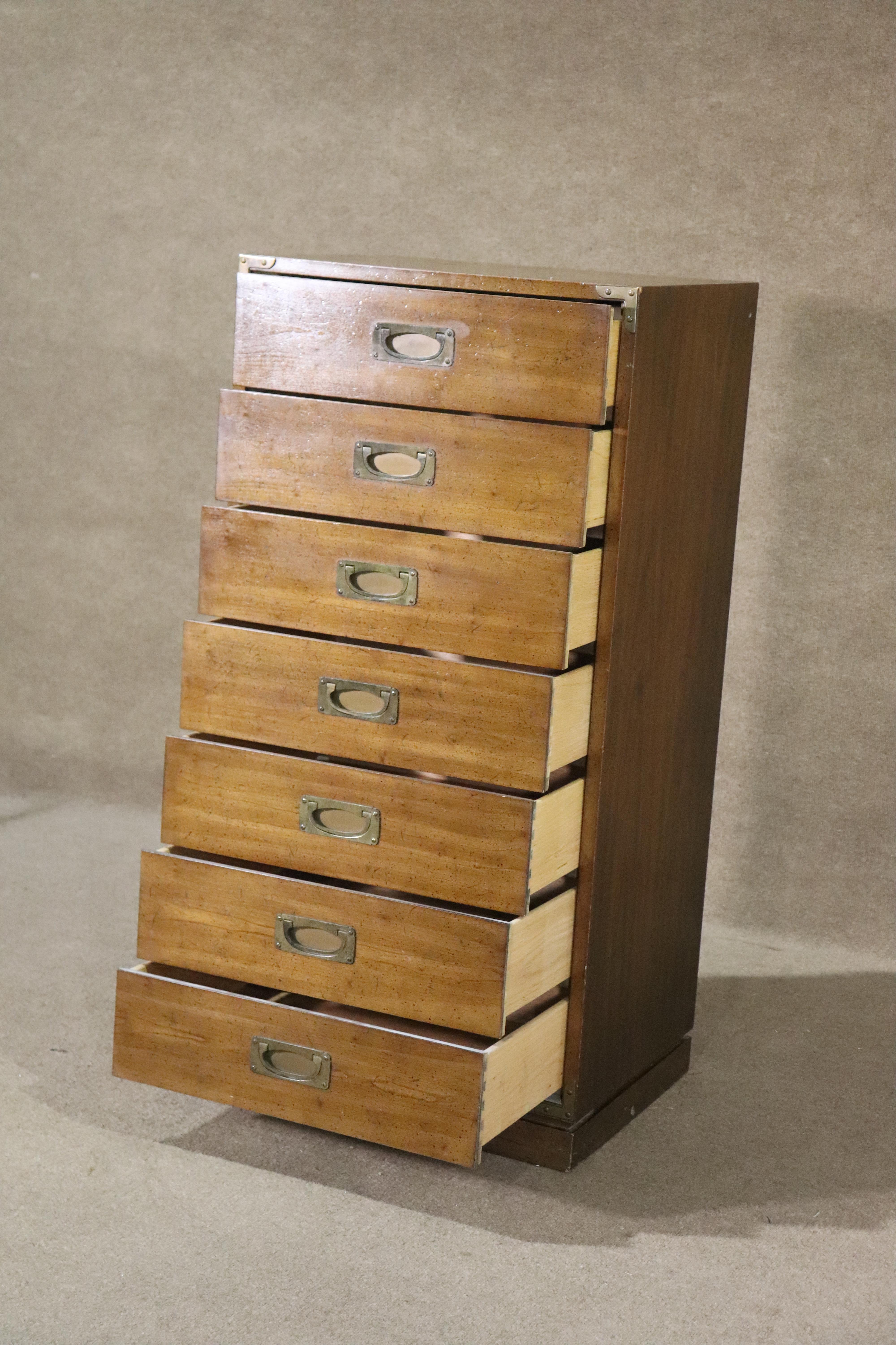 Mid-century modern tall chest of drawers by Drexel for their 'Barbados' collection. Featuring brass hardware and accents, giving a campaign style.
Please confirm location NY or NJ