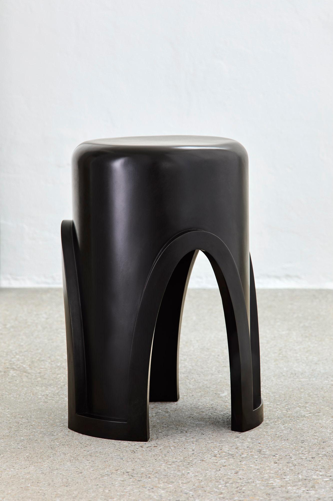 Unique Lingh Hand-Patinated Dark Bronze Side Table by Megarisiotis
Limited Edition.
Dimensions: Ø 34 x H 49 cm.
Materials: Hand-patinated bronze.

LINGH blends personal inspirations from the sacred Hindu lingam with Gothic and Islamic architectural