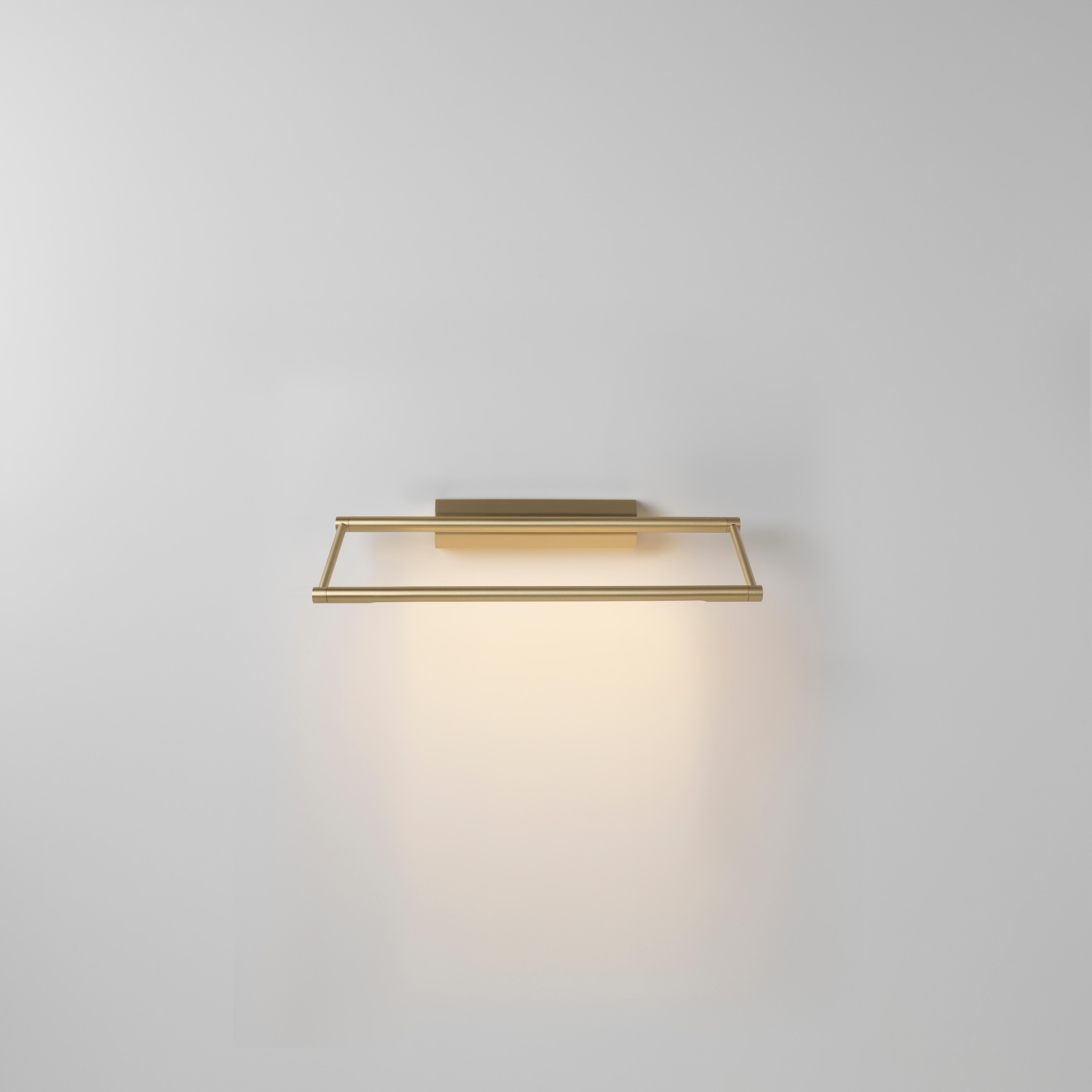 Link 325 brass wall light by Emilie Cathelineau
Dimensions: D 32.5 x W 11.5 x H 4.4 cm
Materials: Solid brass, Satin Polycarbonate diffuser, Black textile cable (2m)
Others finishes and dimensions are available.

All our lamps can be wired