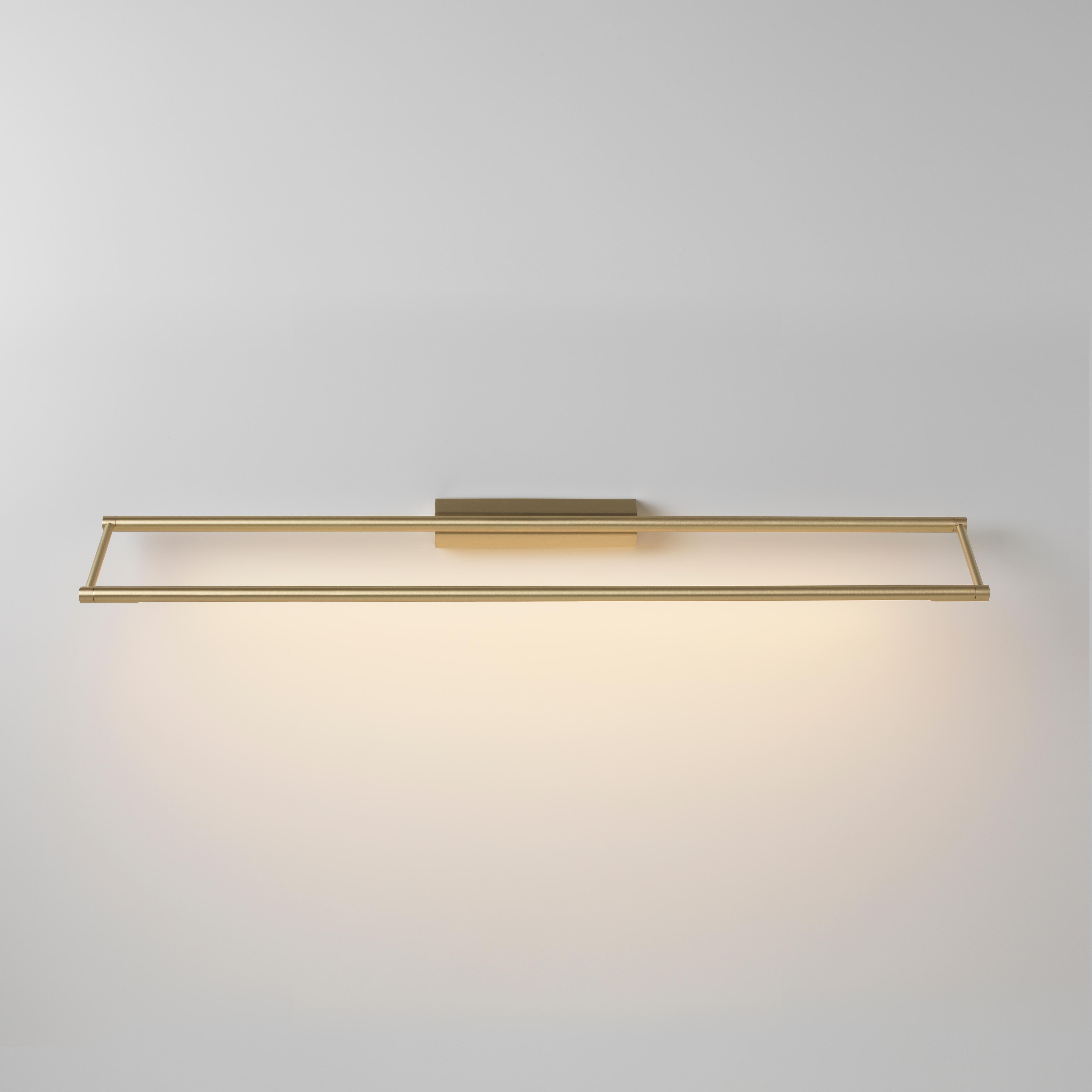 Link 725 brass wall light by Emilie Cathelineau
Dimensions: D 72.5 x W 11.5 x H 4.4 cm
Materials: Solid brass, Satin Polycarbonate diffuser, Black textile cable (2m)
Others finishes and dimensions are available.

All our lamps can be wired