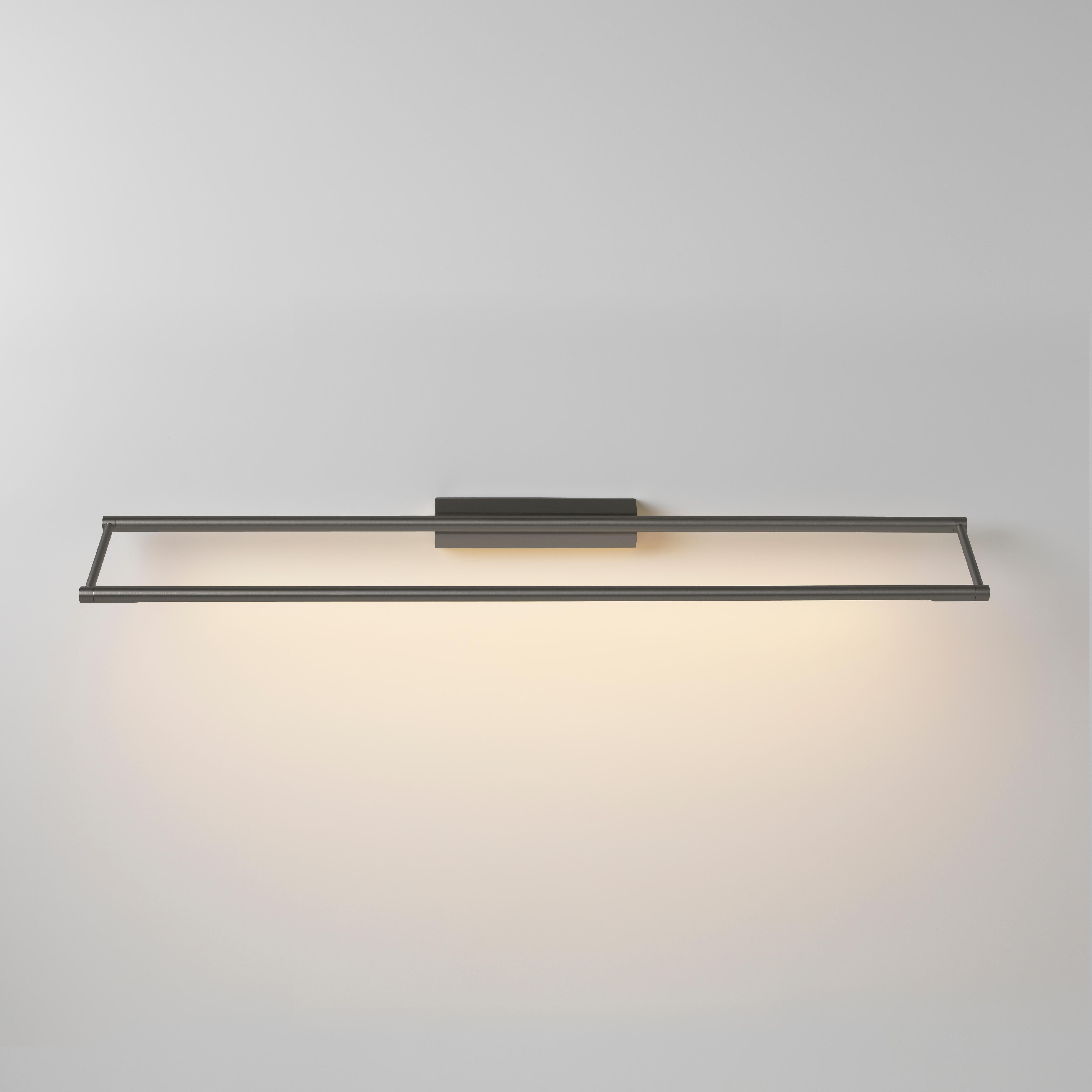 Link 725 Graphite wall light by Emilie Cathelineau
Dimensions: D 72.5 x W 11.5 x H 4.4 cm
Materials: Solid brass, Satin Polycarbonate diffuser, Black textile cable (2m)
Others finishes and dimensions are available.

All our lamps can be wired