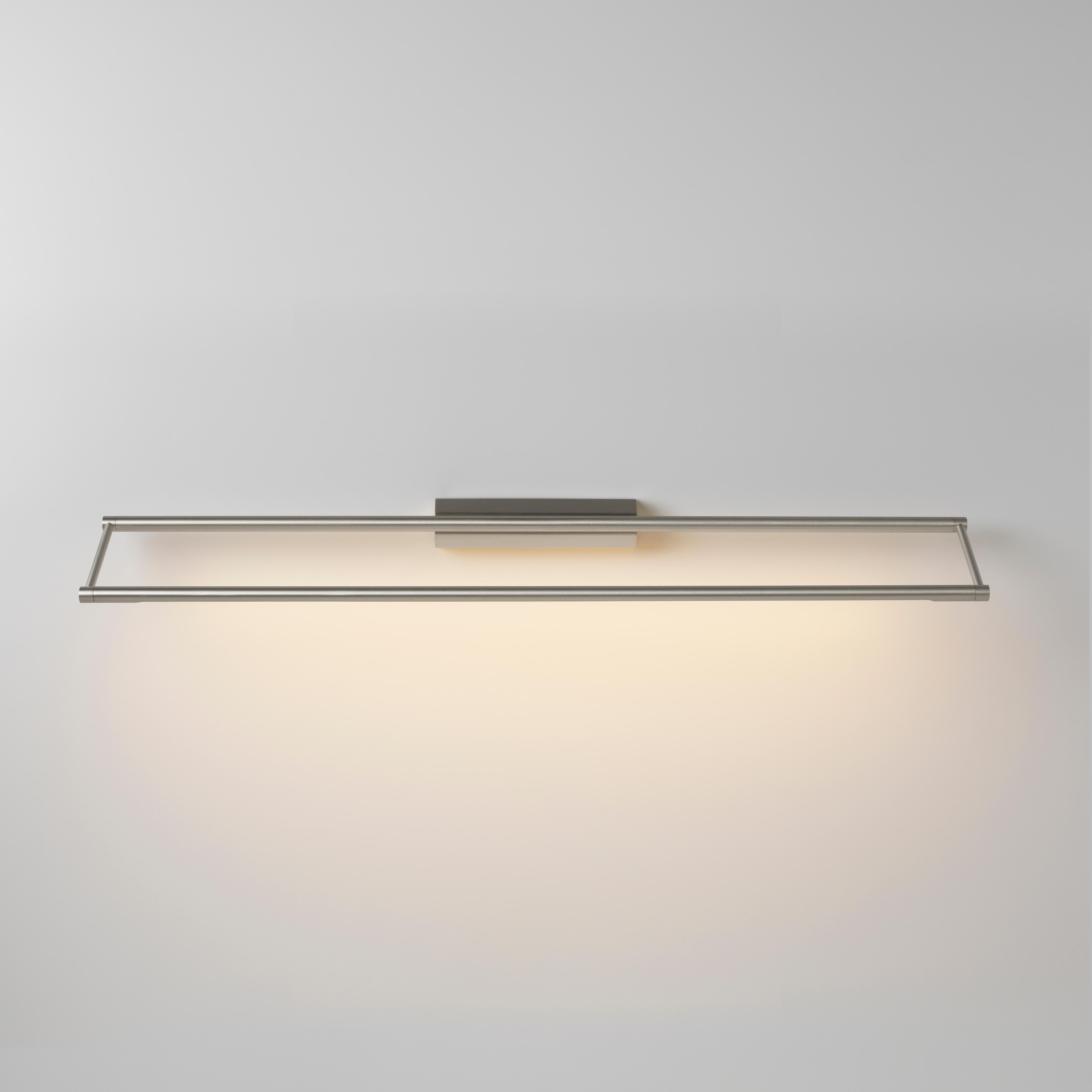 Link 725 Nickel wall light by Emilie Cathelineau
Dimensions: D 72.5 x W 11.5 x H 4.4 cm
Materials: Solid brass, Satin Polycarbonate diffuser, Black textile cable (2m)
Others finishes and dimensions are available.

All our lamps can be wired