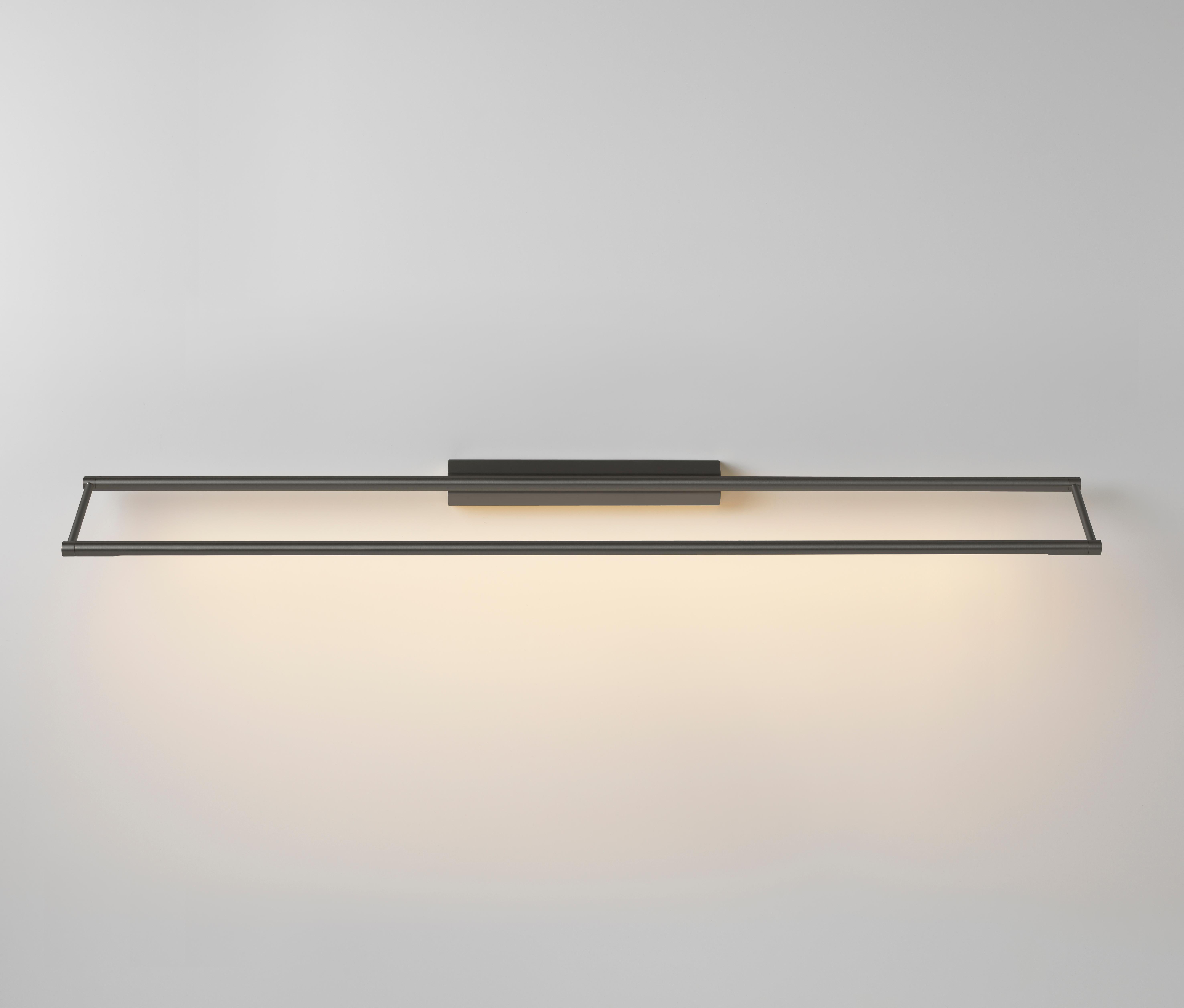 Link 985 Graphite wall light by Emilie Cathelineau
Dimensions: D 98.5 x W 11.5 x H 4.4 cm
Materials: Solid brass, Satin Polycarbonate diffuser, Black textile cable (2m)
Others finishes and dimensions are available.

All our lamps can be wired