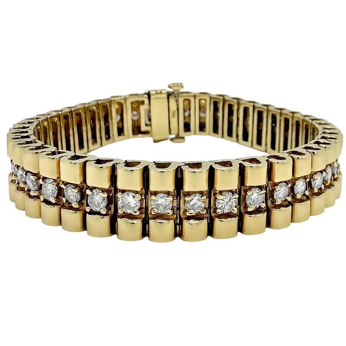 A sparkling, casual line bracelet, fabricated crisply from 14k yellow gold. A single line of forty-two round brilliant cut diamonds run the entire length and have a total approximate weight of 4.00ct. Overall diamond quality is H color and VS1-2