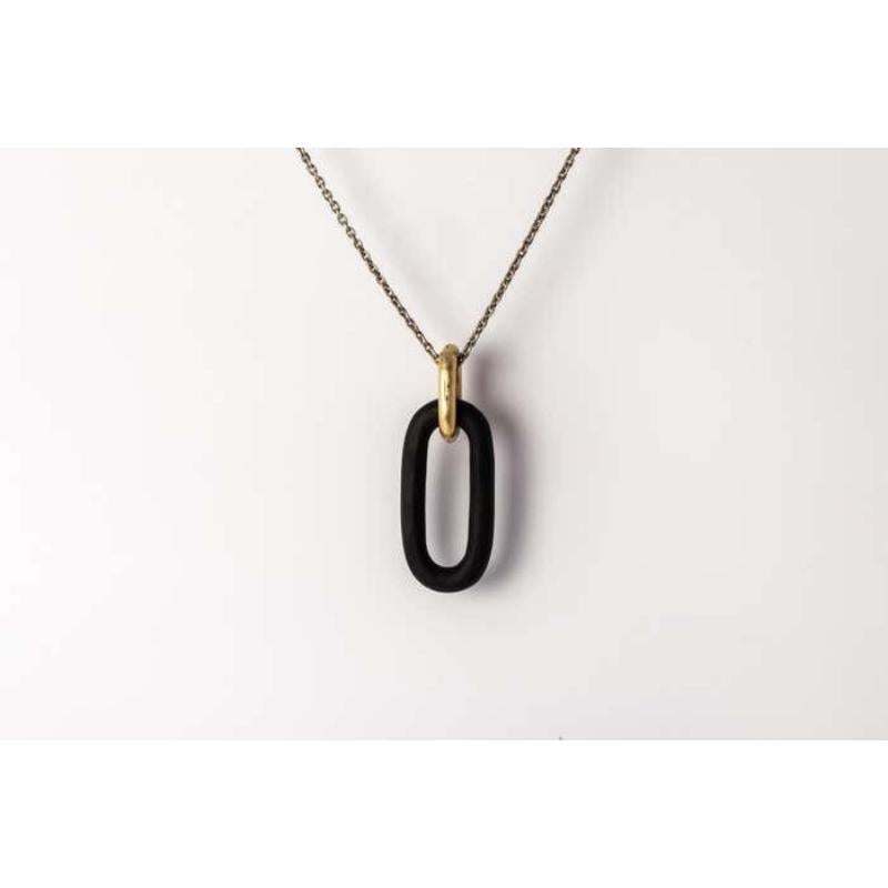 Pendant necklace in wood with gold plated brass link, it comes on a 74cm sterling silver chain. All wood links are handcarved. 