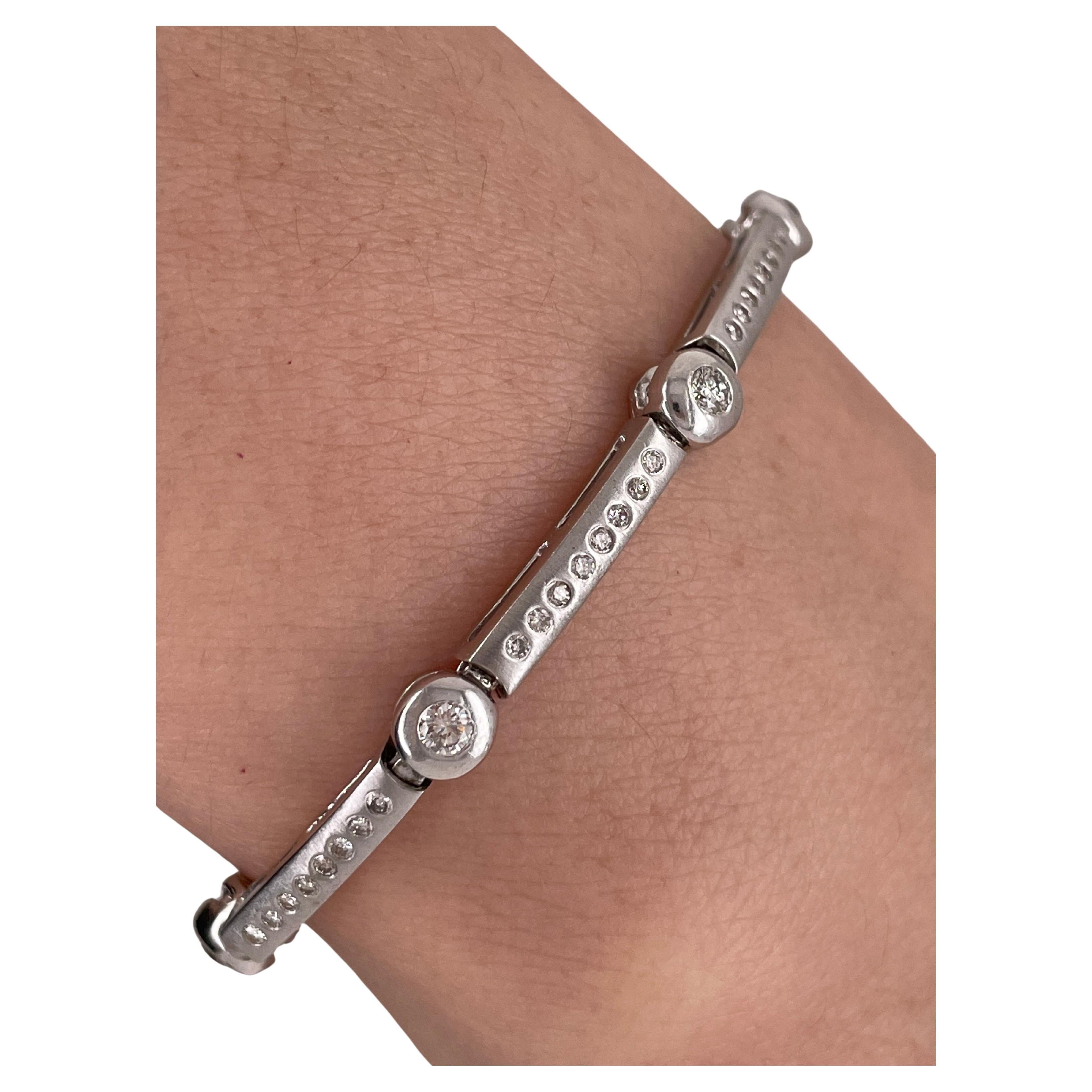 Link or Tennis Bracelet with diamonds, 14kt White Gold having eight large links holding eight diamonds and one large diamond between each link. Fine brilliant diamonds. 
Length:  7.5 Inches
Size: 12.1 Grams
81 Total Diamonds